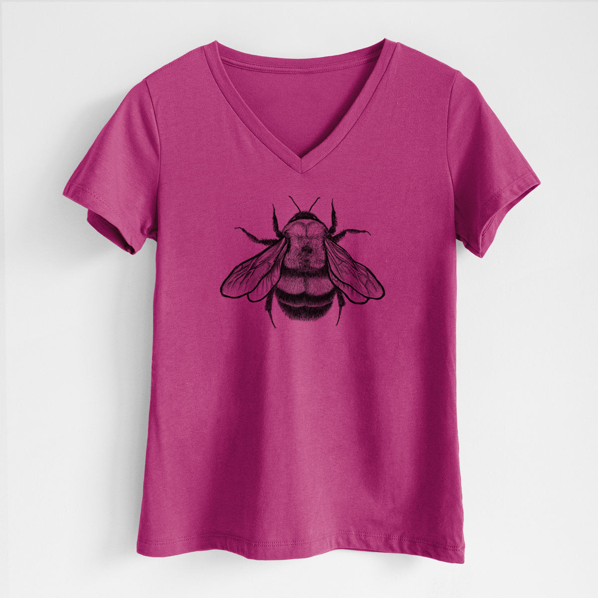 Berry pink women's relaxed fit cotton V-neck t-shirt laid flat, printed with a detailed black ink illustration of a rusty patched bumble bee with its wings spread, seen from above.