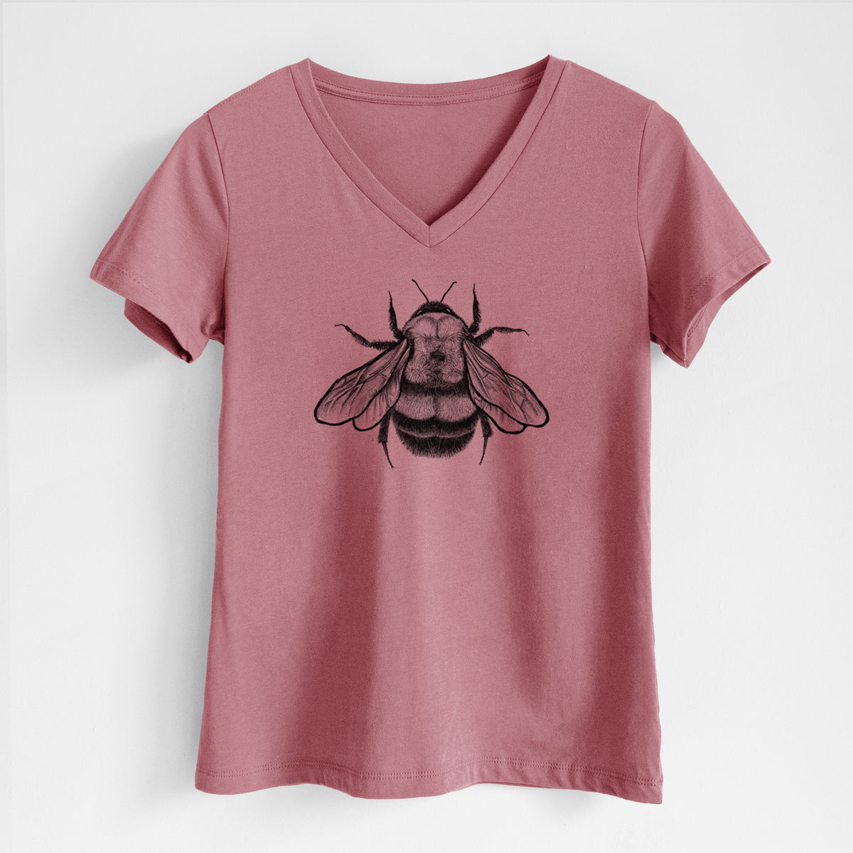 Mauve pink women's relaxed fit cotton V-neck t-shirt laid flat, printed with a detailed black ink illustration of a rusty patched bumble bee with its wings spread, seen from above.