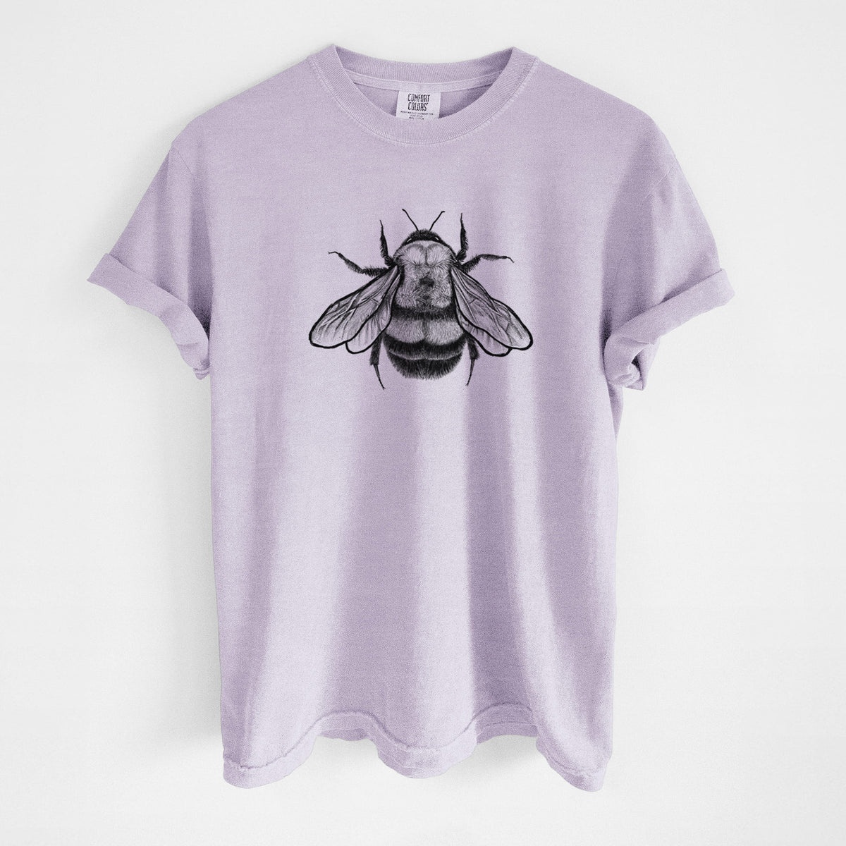 Orchid purple Comfort Colors t-shirt laid flat, printed with a detailed black ink illustration of a rusty patched bumble bee with its wings spread, seen from above.