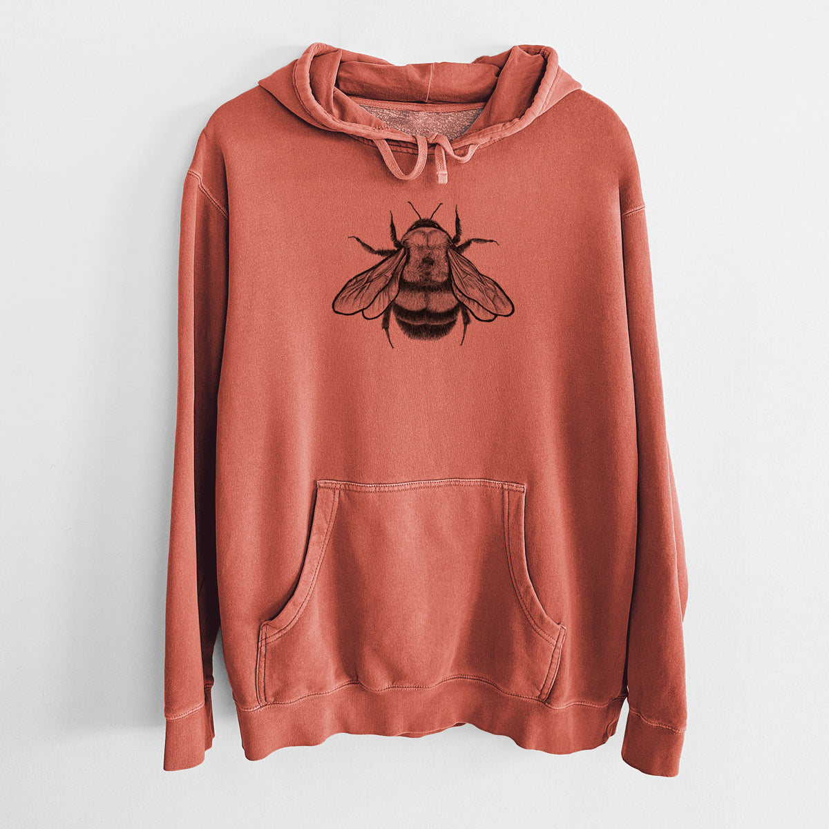 Amber orange pigment dyed hoodie laid flat, printed with a detailed black ink illustration of a rusty patched bumble bee with its wings spread, seen from above.