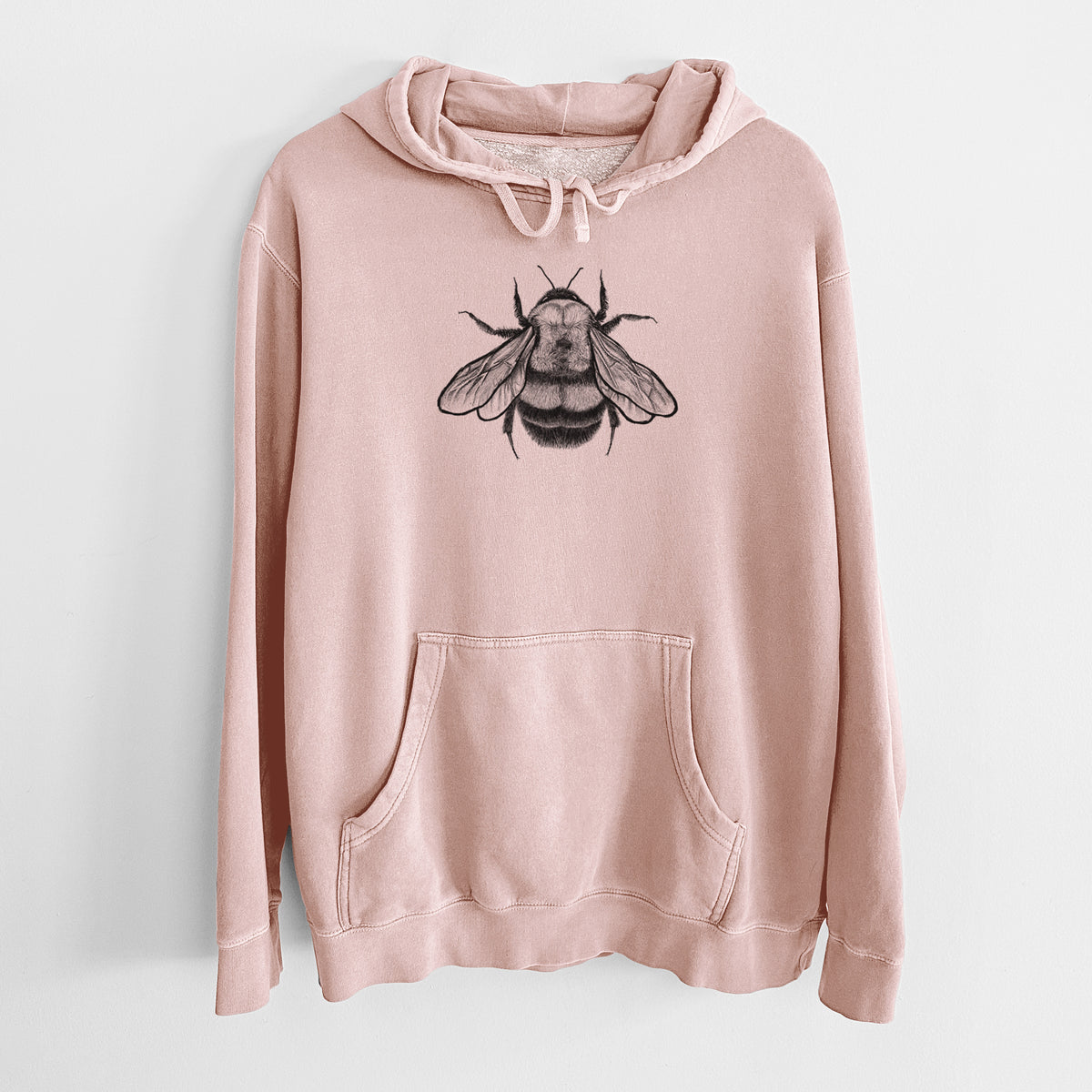 Dusty pink pigment dyed hoodie laid flat, printed with a detailed black ink illustration of a rusty patched bumble bee with its wings spread, seen from above.