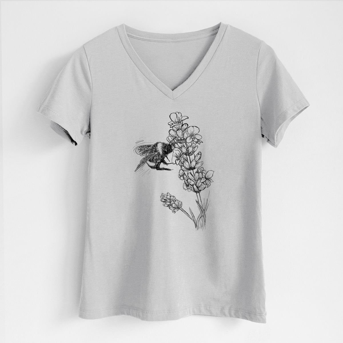 Lunar grey women's relaxed fit cotton V-neck t-shirt laid flat, printed with a black ink illustration of a bumble bee visiting a sprig of lavender.