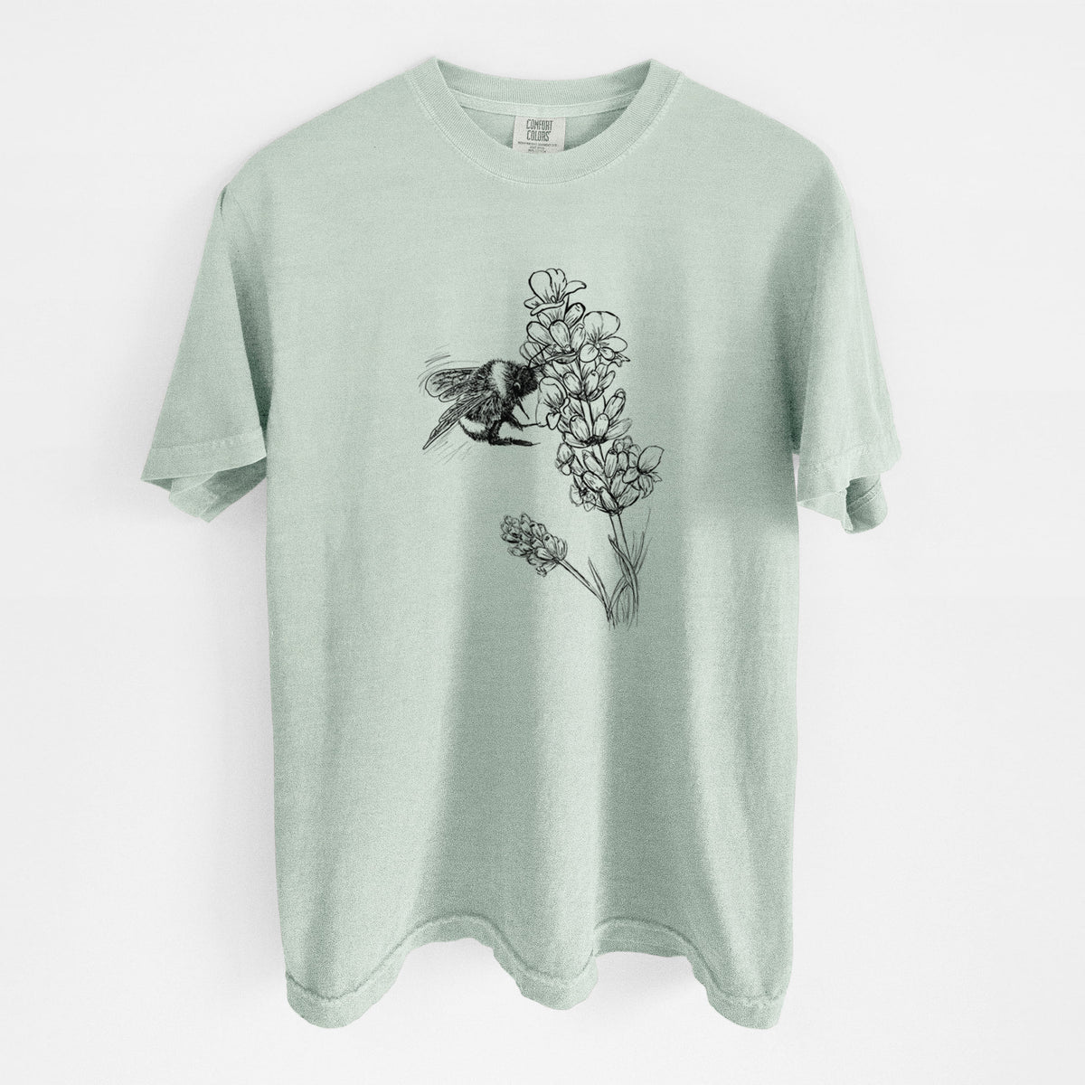 Bay green Comfort Colors t-shirt laid flat, printed with a black ink illustration of a bumble bee visiting a sprig of lavender.