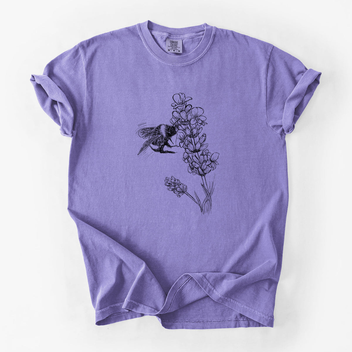 Violet purple Comfort Colors t-shirt laid flat, printed with a black ink illustration of a bumble bee visiting a sprig of lavender.