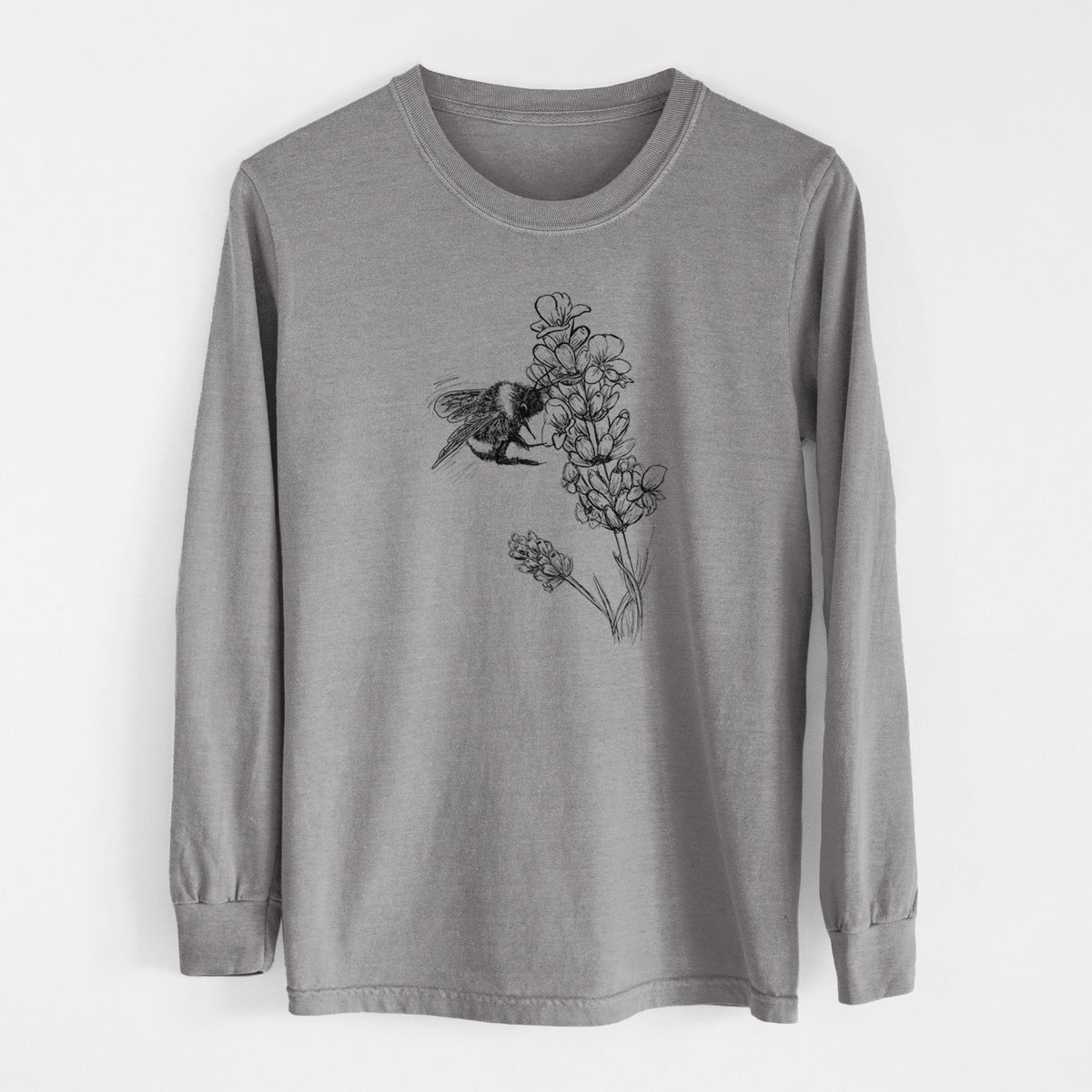 Grey Comfort Colors long sleeve shirt laid flat, printed with a black ink illustration of a bumble bee visiting a sprig of lavender.