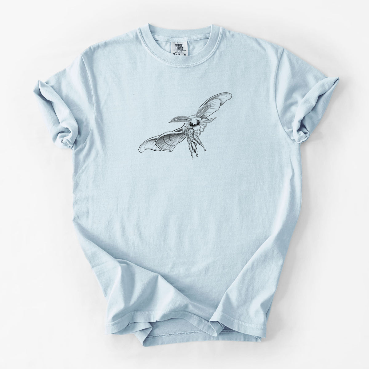 Chambray blue Comfort Colors t-shirt laid flat, printed with a black ink illustration of a silk moth with its wings spread.