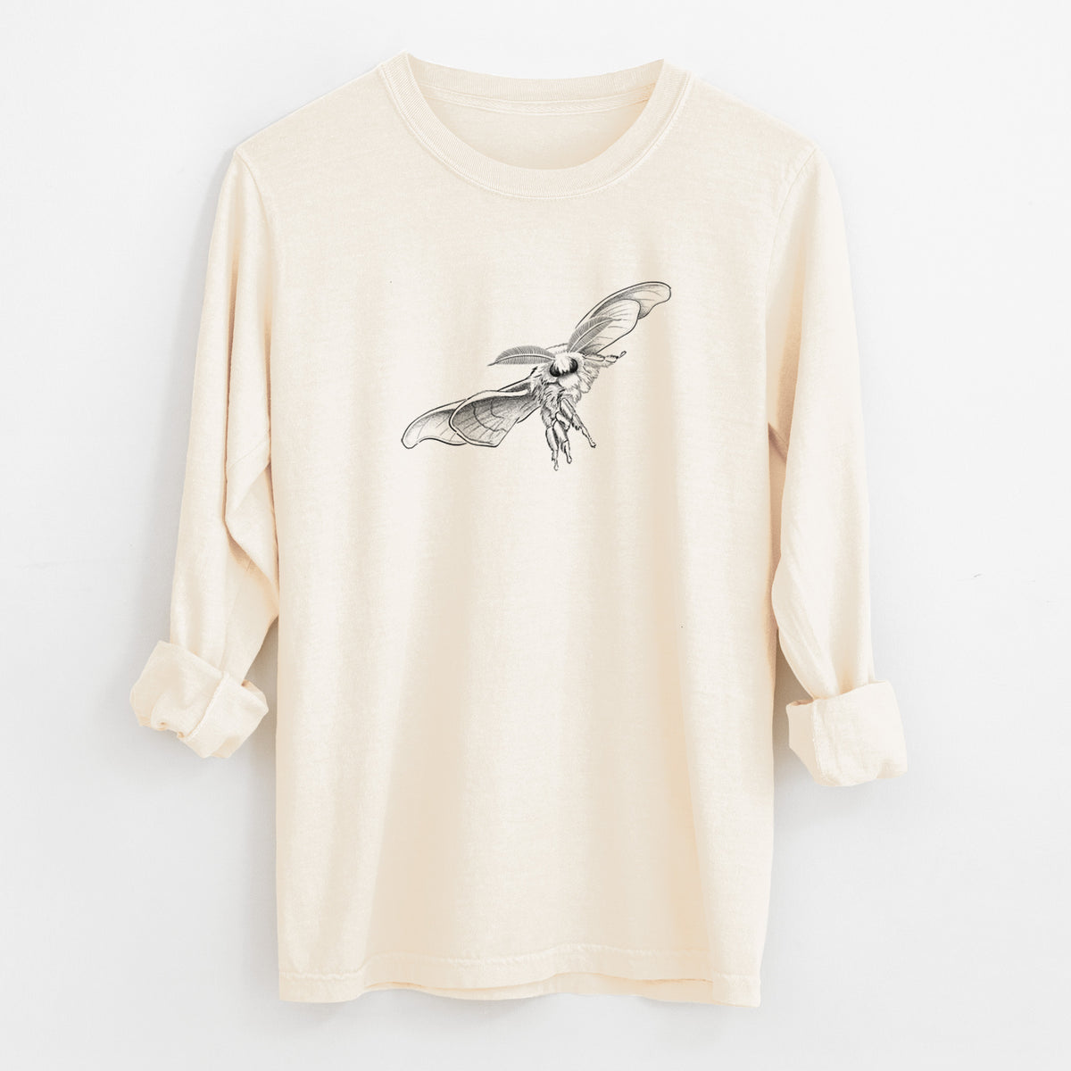 Ivory Comfort Colors long sleeve shirt laid flat with the cuffs rolled, printed with a black ink illustration of a silk moth with its wings spread.