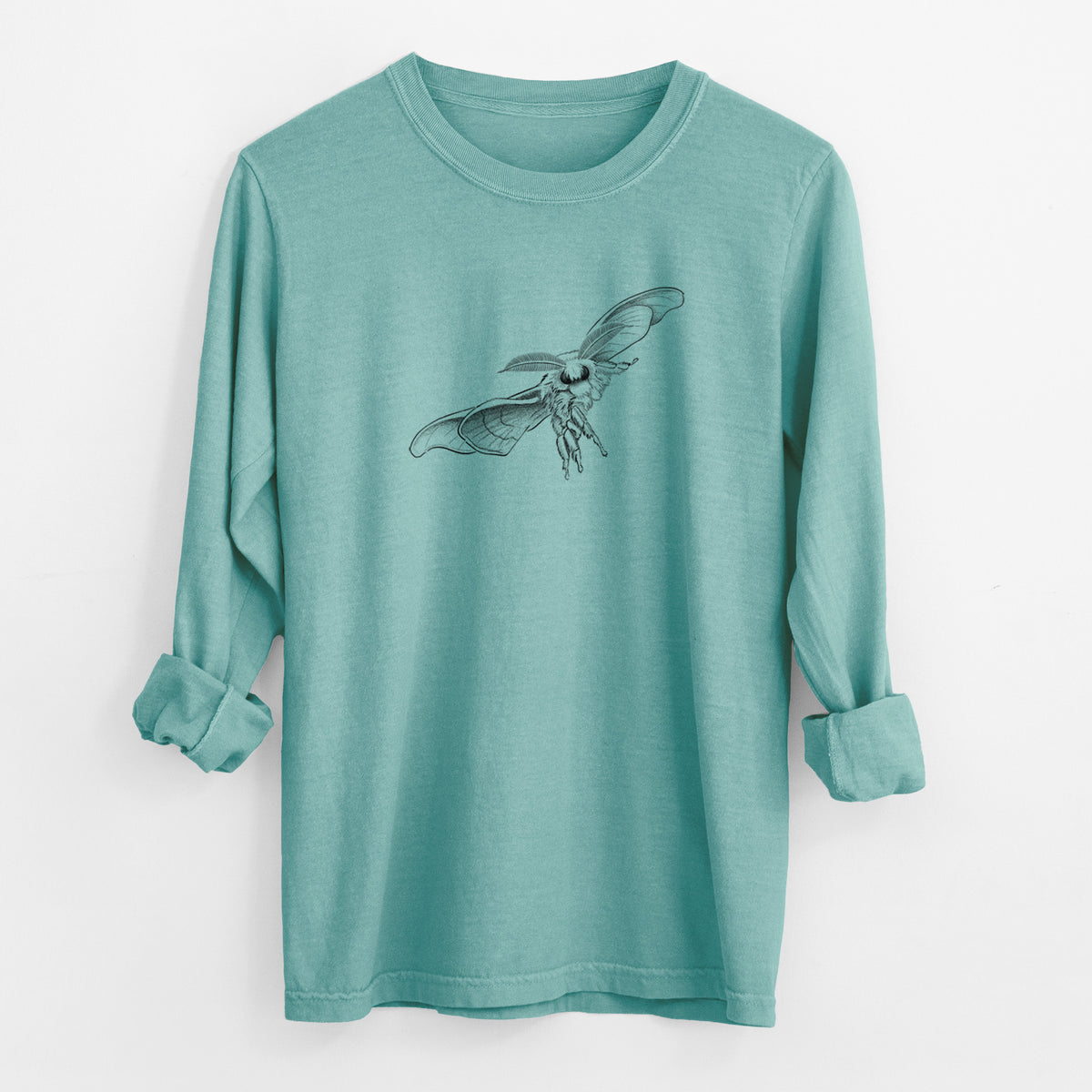 Reef green Comfort Colors long sleeve shirt laid flat with the cuffs rolled, printed with a black ink illustration of a silk moth with its wings spread.