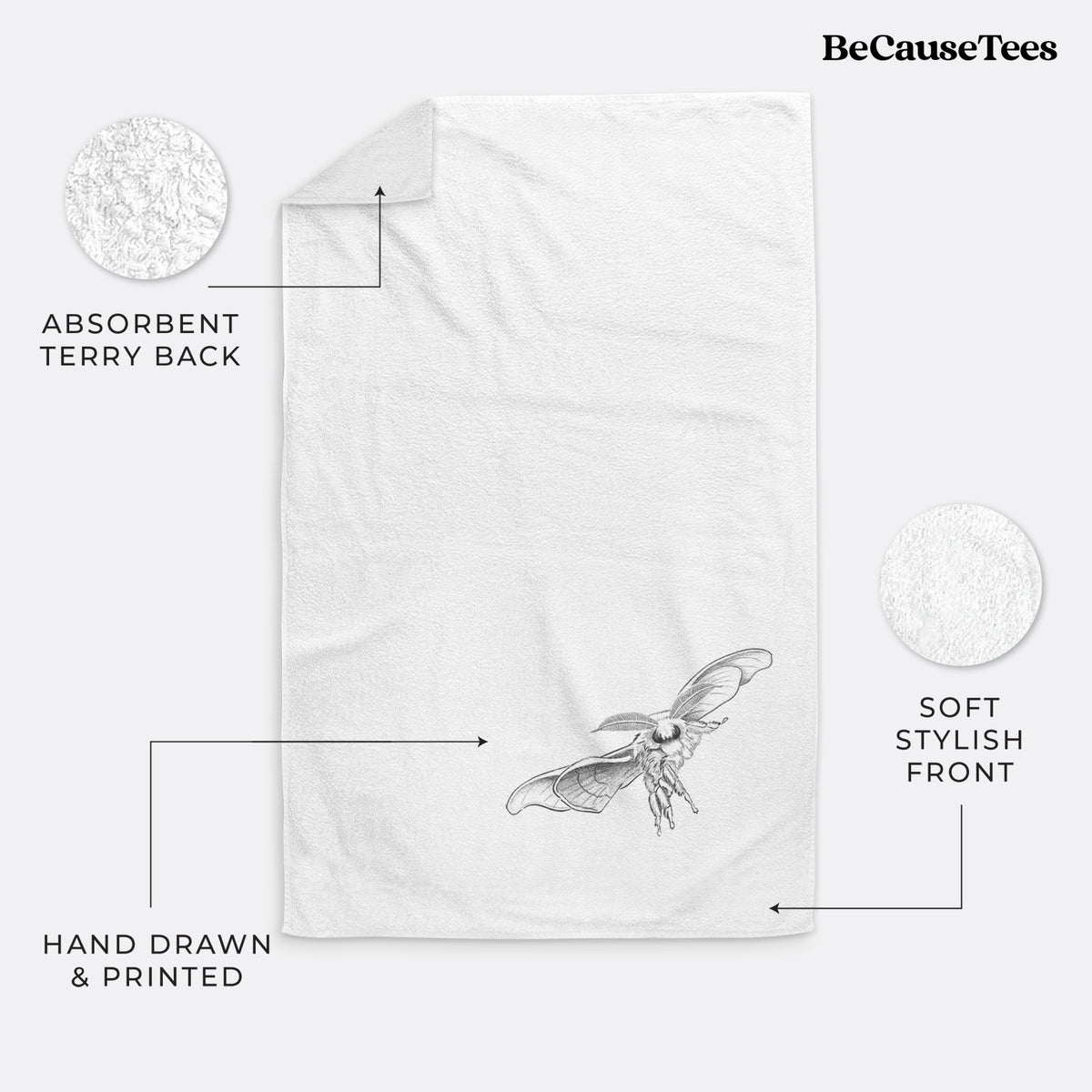 White hand towel printed with a black ink illustration of a silk moth with its wings spread.