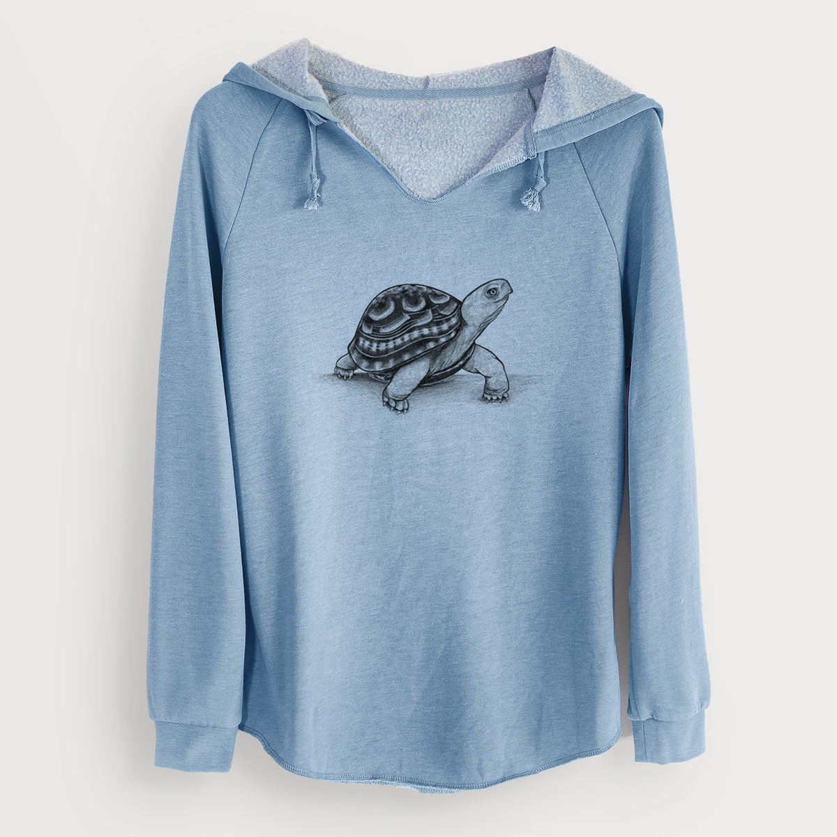 Misty blue women's Cali Wave hooded sweatshirt laid flat, printed with a detailed black ink illustration of an eastern box turtle walking.