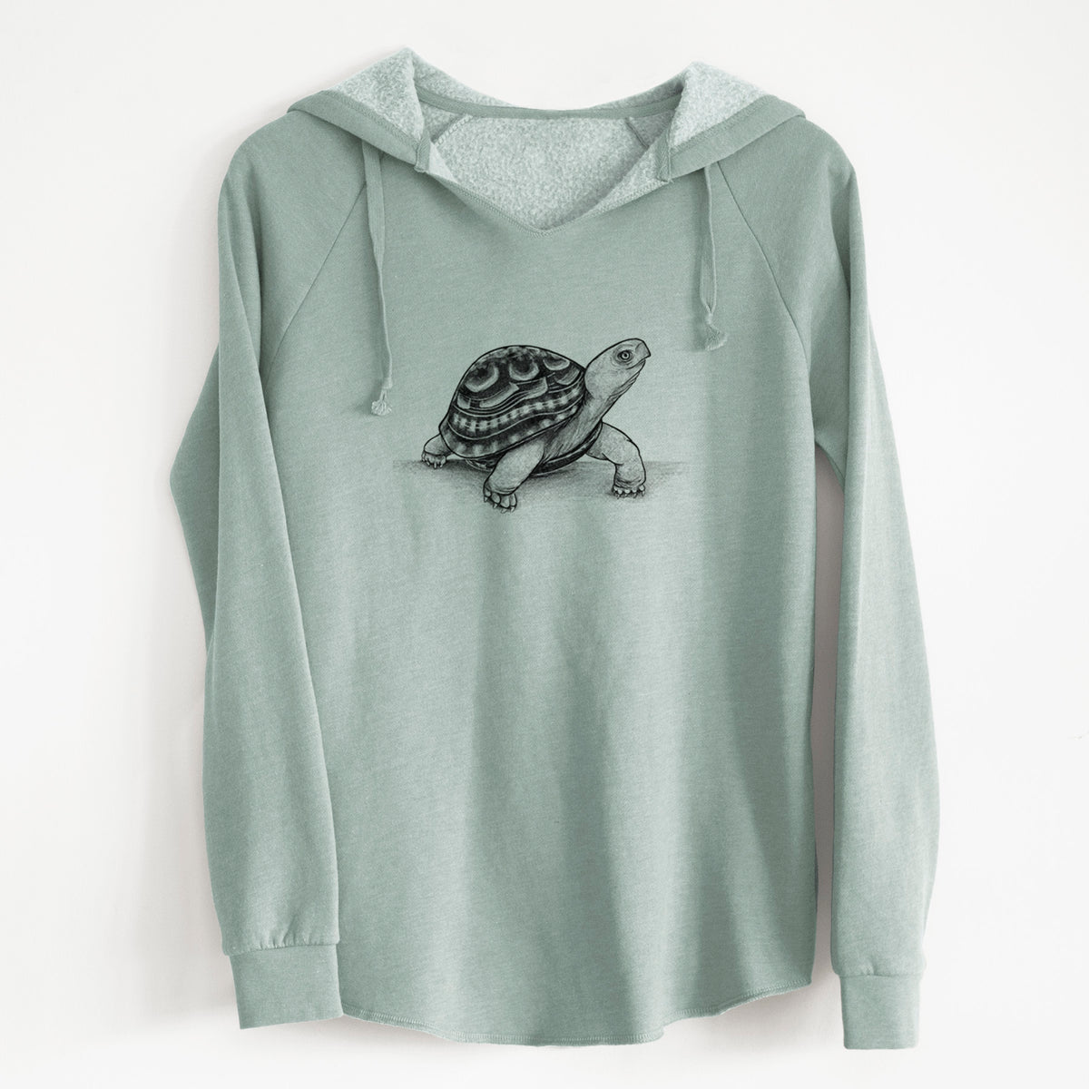 Sage green women's Cali Wave hooded sweatshirt laid flat, printed with a detailed black ink illustration of an eastern box turtle walking.