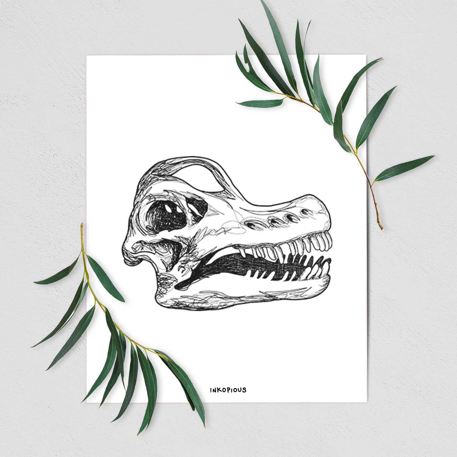 Art print of a detailed black ink illustration of a Brachiosaurus skull, shown with eucalyptus leaves.