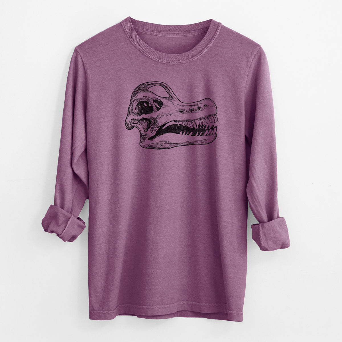 Berry pink Comfort Colors long sleeve shirt laid flat with the cuffs rolled, printed with a detailed black ink illustration of a Brachiosaurus skull.