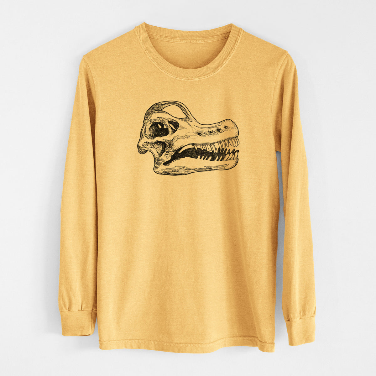 Golden wheat yellow Comfort Colors long sleeve shirt laid flat, printed with a detailed black ink illustration of a Brachiosaurus skull.