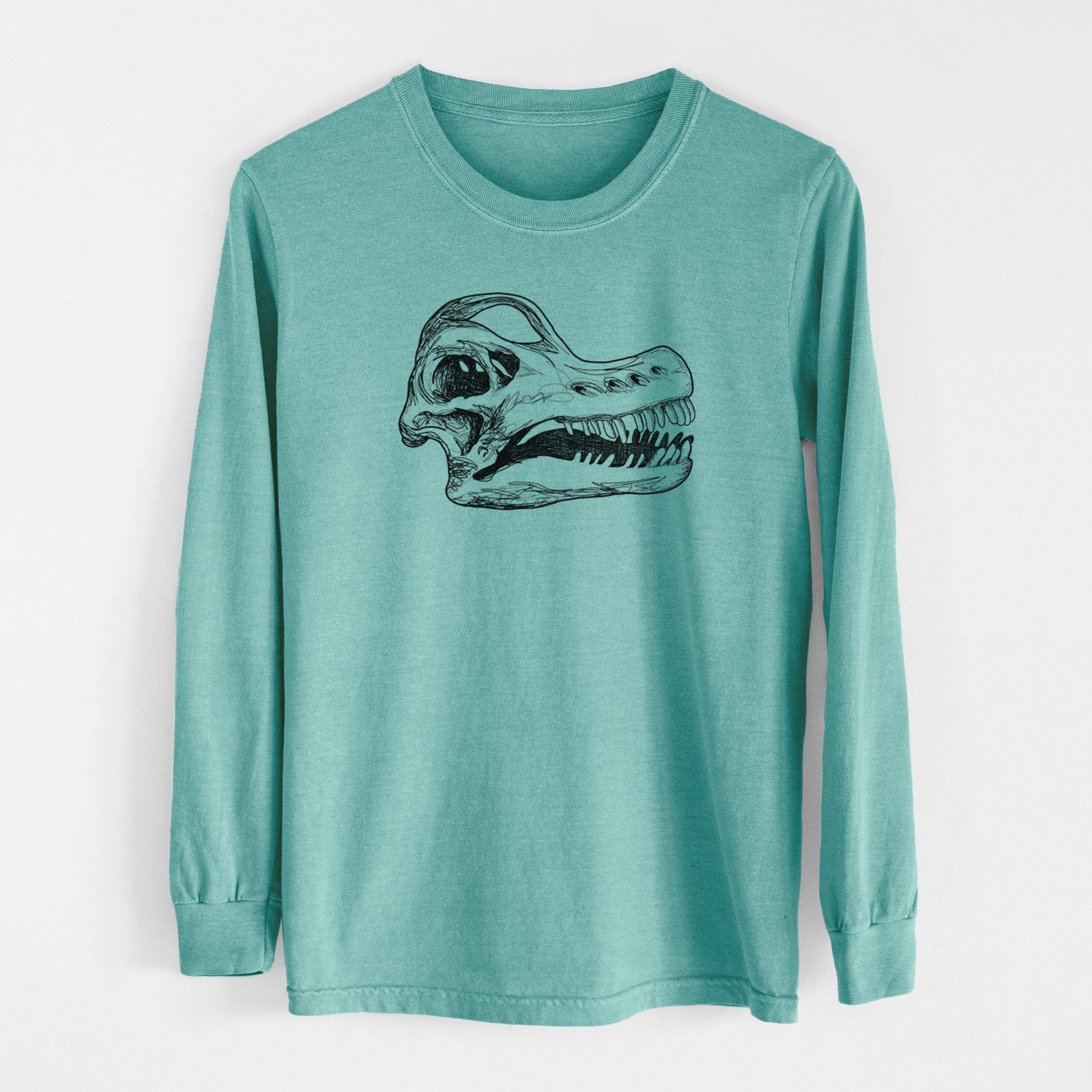Reef green Comfort Colors long sleeve shirt laid flat, printed with a detailed black ink illustration of a Brachiosaurus skull.