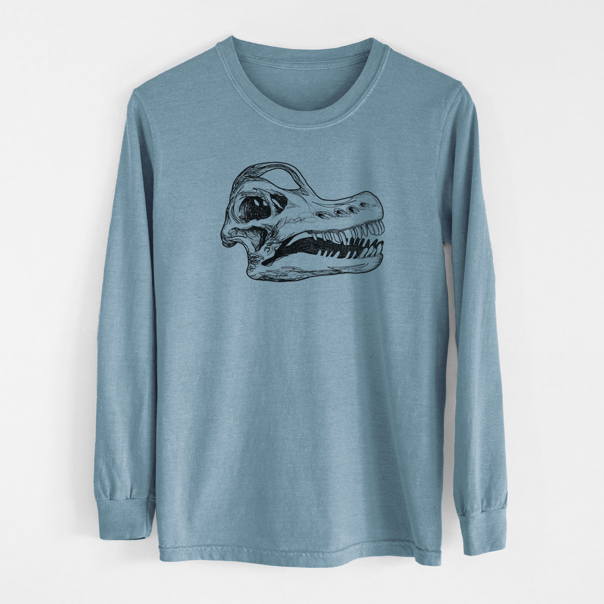 Steel blue Comfort Colors long sleeve shirt laid flat, printed with a detailed black ink illustration of a Brachiosaurus skull.