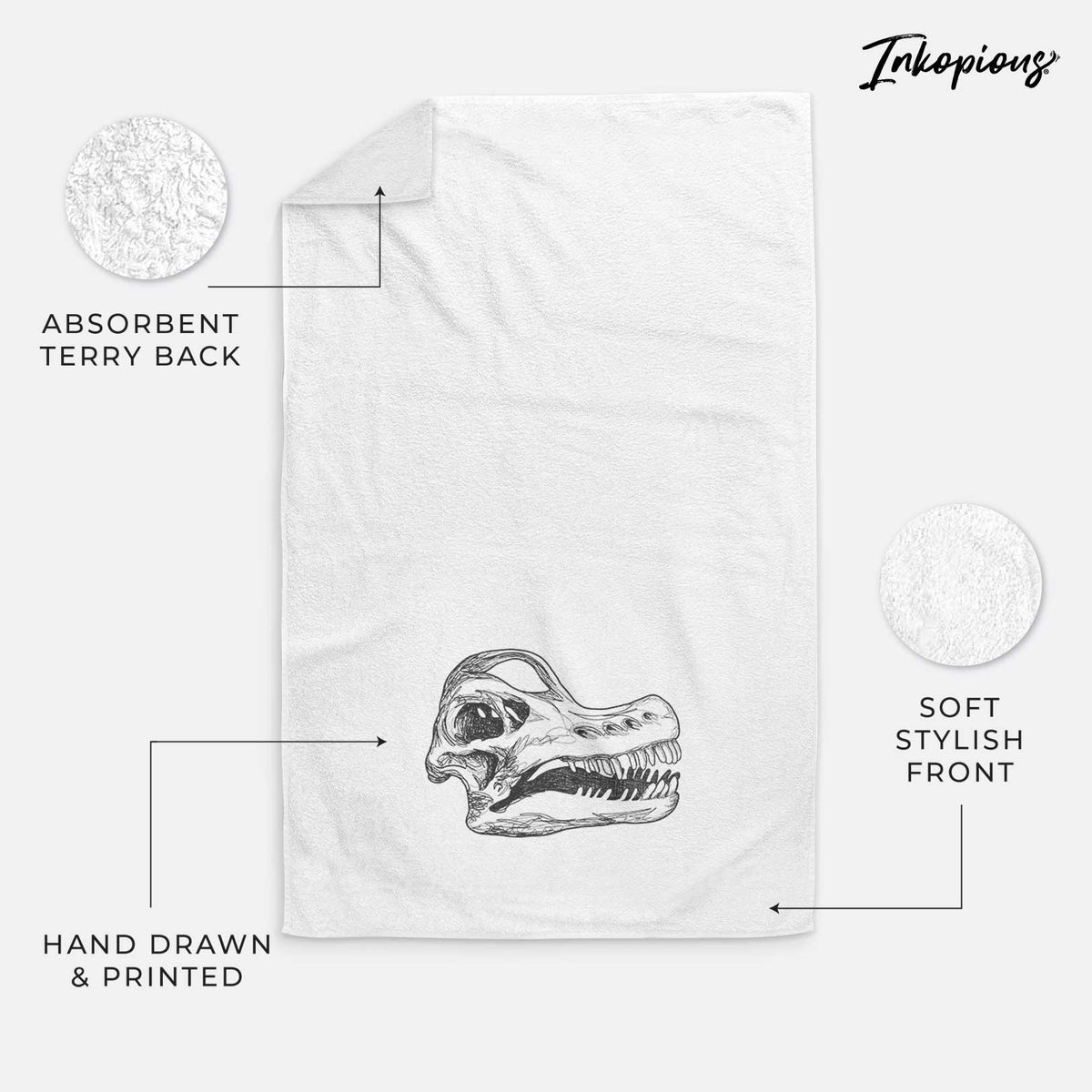 White hand towel printed with a detailed black ink illustration of a Brachiosaurus skull.