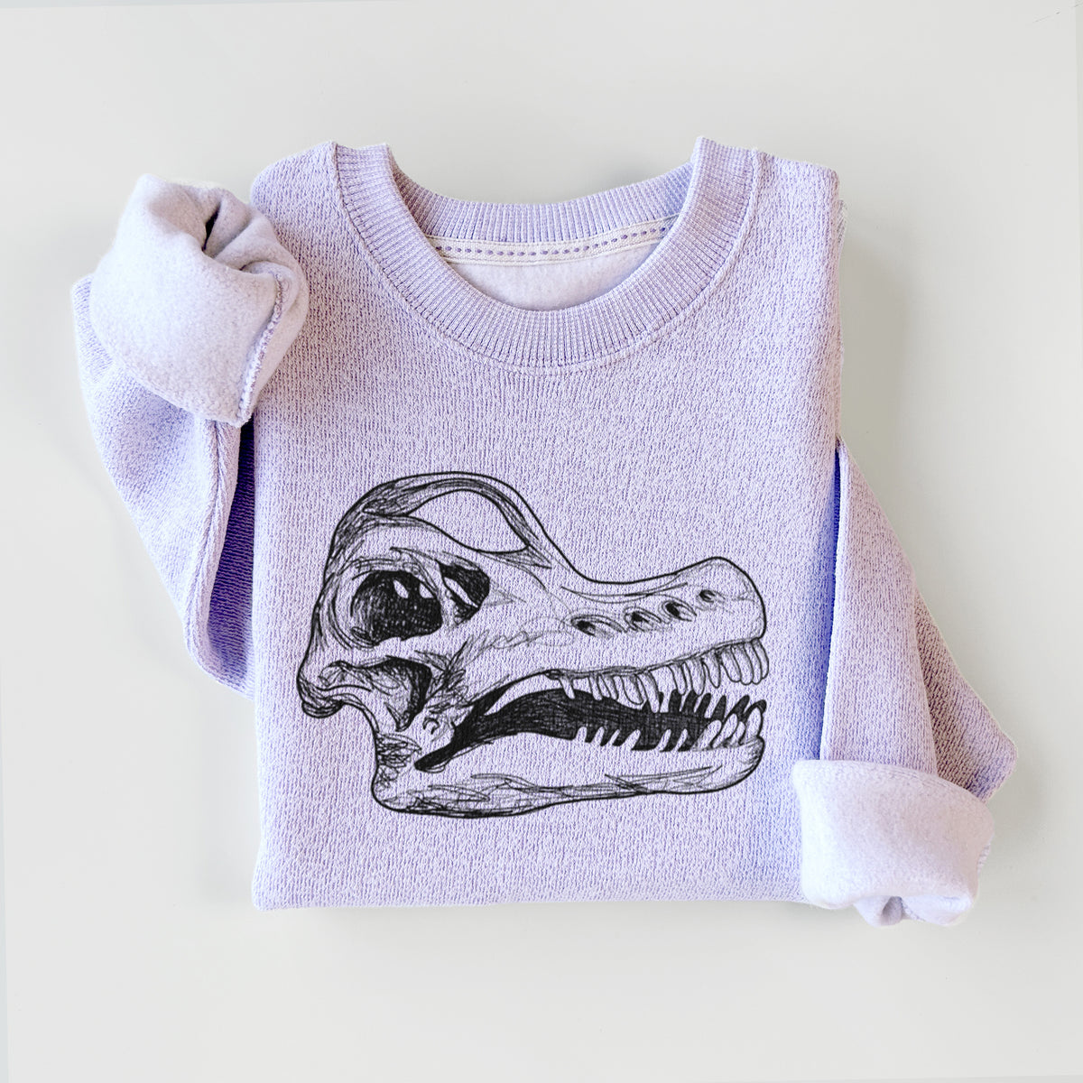Ice purple knit sweatshirt printed with a detailed black ink illustration of a Brachiosaurus skull, styled flat.