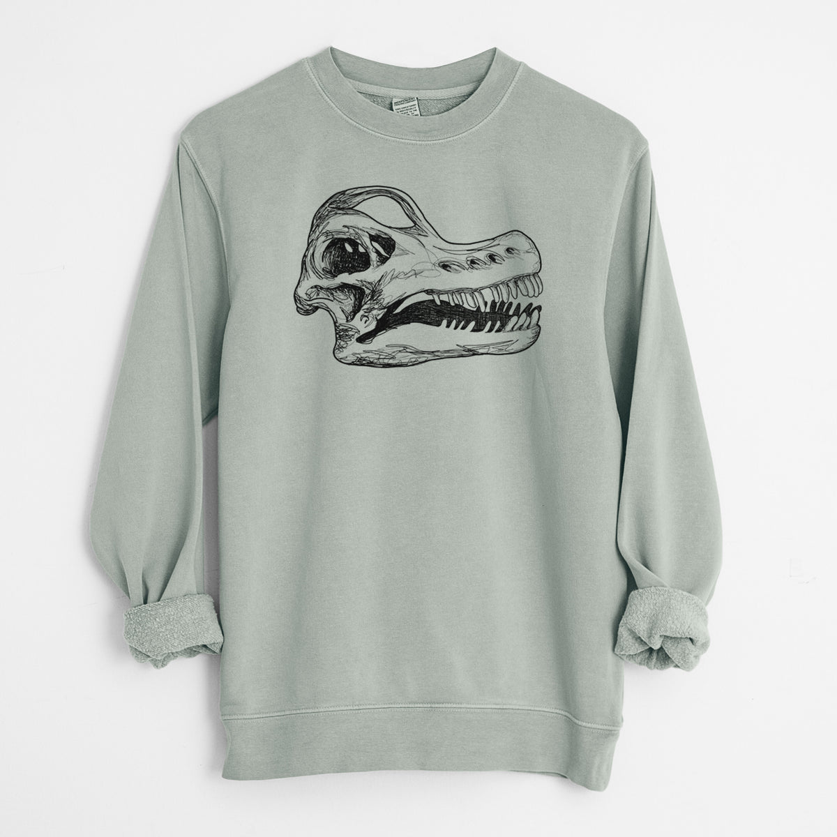 Sage green pigment dyed crewneck sweatshirt laid flat with the sleeves rolled, printed with a detailed black ink illustration of a Brachiosaurus skull.