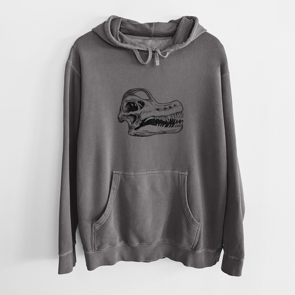 Faded black pigment dyed hoodie laid flat, printed with a detailed black ink illustration of a Brachiosaurus skull.