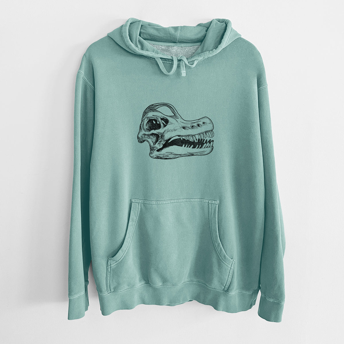 Mint green pigment dyed hoodie laid flat, printed with a detailed black ink illustration of a Brachiosaurus skull.