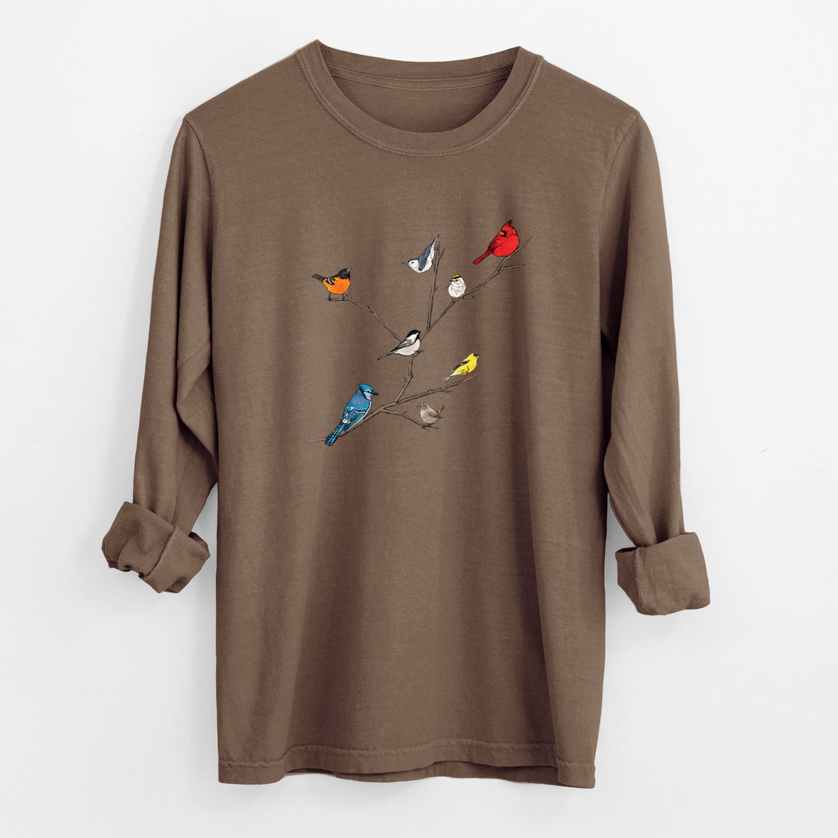 Espresso brown Comfort Colors long sleeve shirt laid flat with the cuffs rolled, printed with a full-color illustration of backyard birds, including a cardinal, blue jay, goldfinch and robin, perched on bare branches.