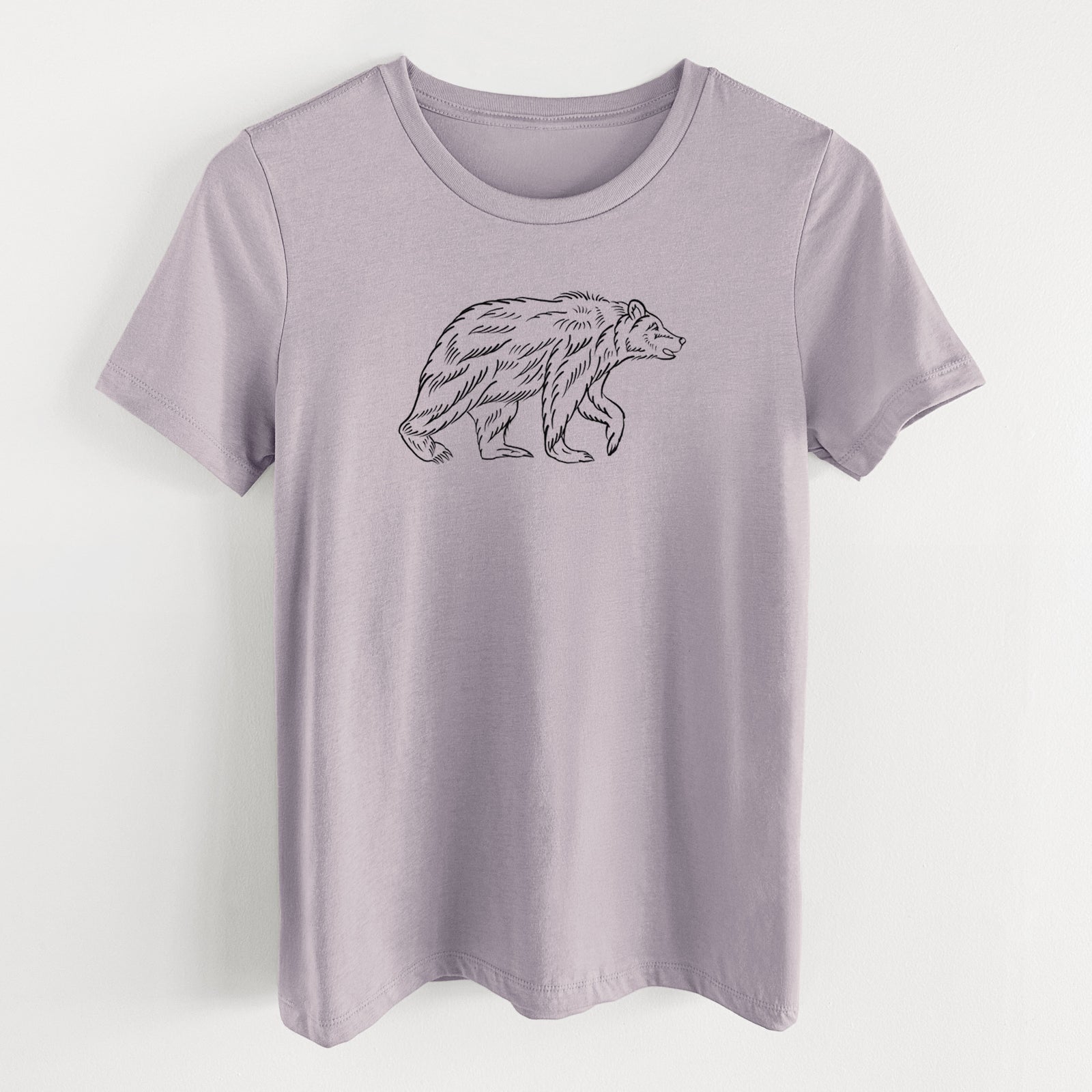 Light violet women's relaxed fit cotton t-shirt laid flat, printed with a black ink illustration of a brown bear walking.