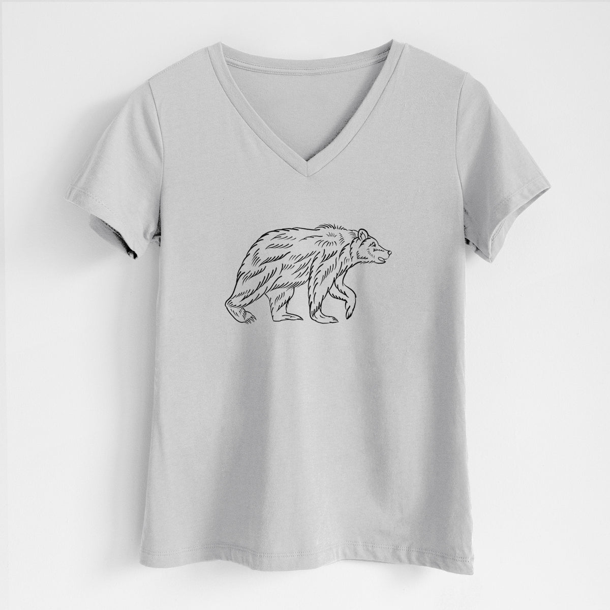 Lunar grey women's relaxed fit cotton V-neck t-shirt laid flat, printed with a black ink illustration of a brown bear walking.