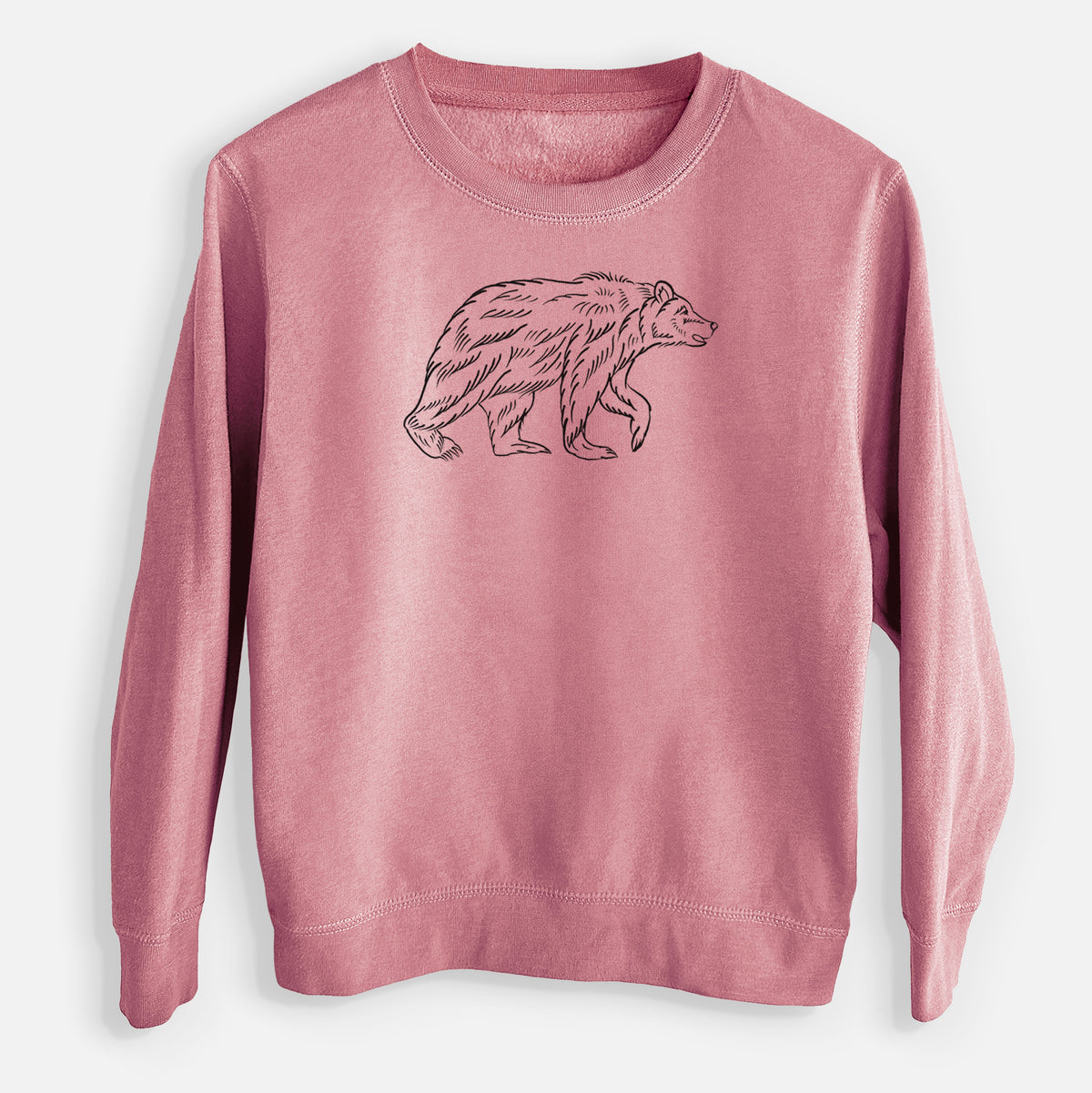 Mauve pink youth crewneck sweatshirt laid flat, printed with a black ink illustration of a brown bear walking.