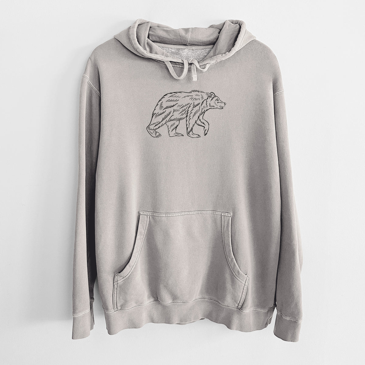 Cement grey pigment dyed hoodie laid flat, printed with a black ink illustration of a brown bear walking.