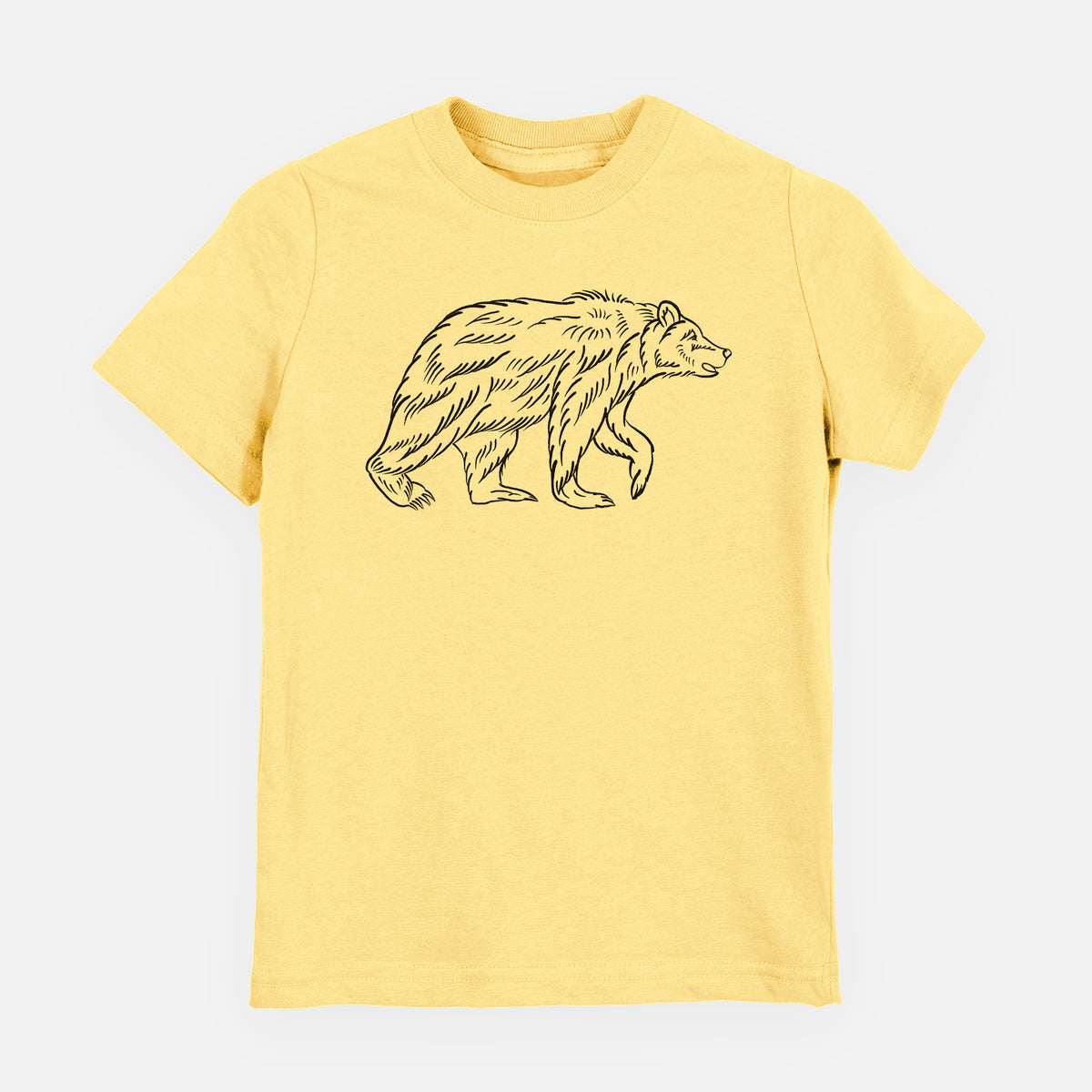 Butter yellow youth t-shirt laid flat, printed with a black ink illustration of a brown bear walking.