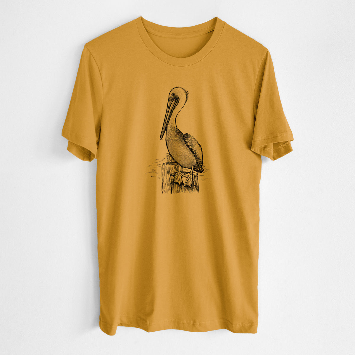 Honeycomb yellow lightweight cotton t-shirt laid flat, printed with a detailed black ink illustration of a brown pelican perched on a wooden piling.