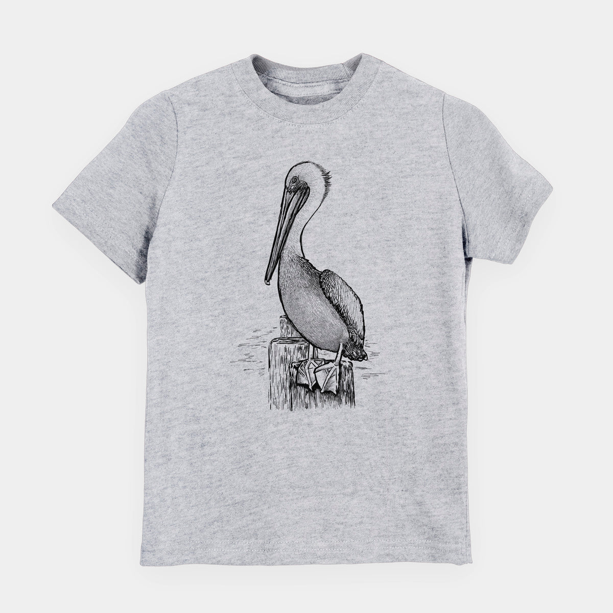 Heather grey youth t-shirt laid flat, printed with a detailed black ink illustration of a brown pelican perched on a wooden piling.