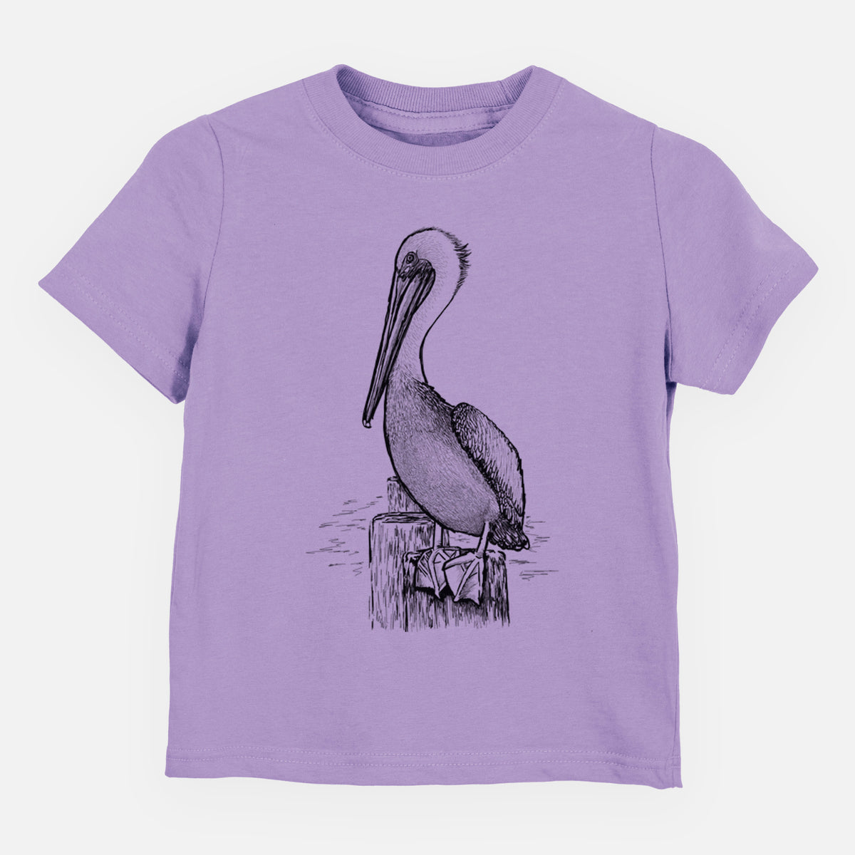 Lavender toddler t-shirt laid flat, printed with a detailed black ink illustration of a brown pelican perched on a wooden piling.