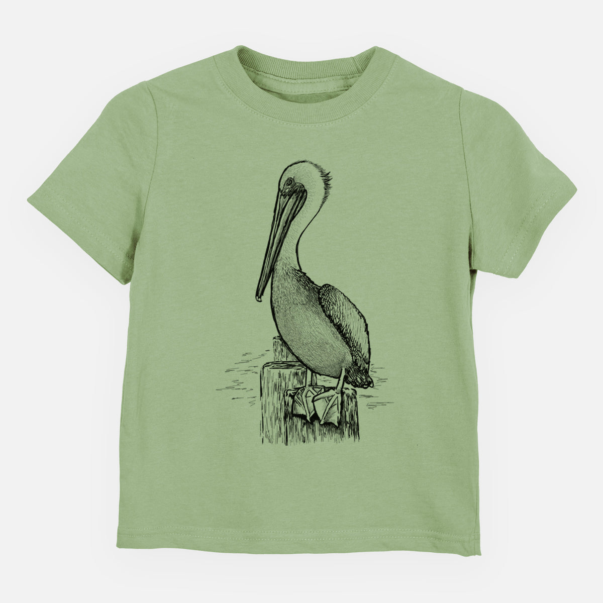 Sage green toddler t-shirt laid flat, printed with a detailed black ink illustration of a brown pelican perched on a wooden piling.