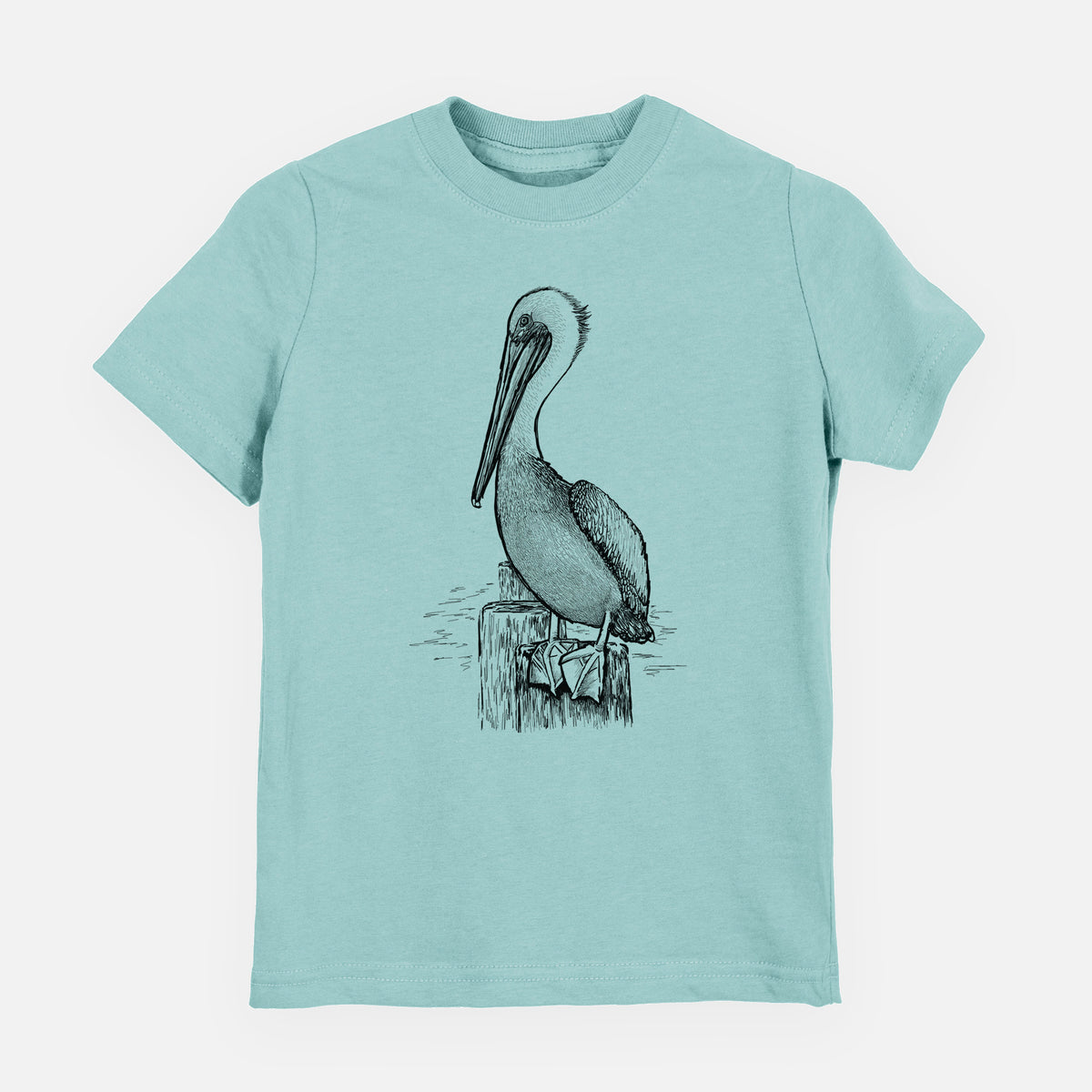 Saltwater youth t-shirt laid flat, printed with a detailed black ink illustration of a brown pelican perched on a wooden piling.