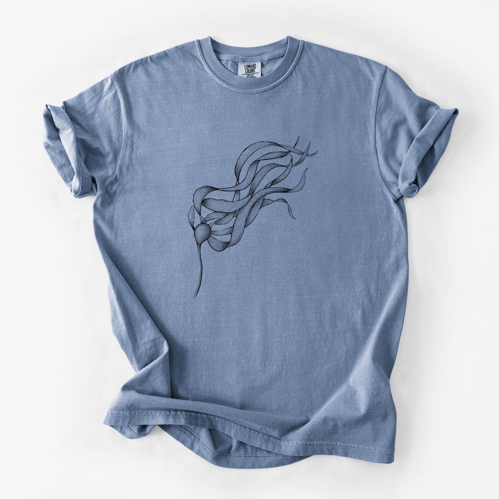 Blue jean Comfort Colors t-shirt laid flat, printed with a black ink line drawing of a strand of bull kelp with long flowing blades.