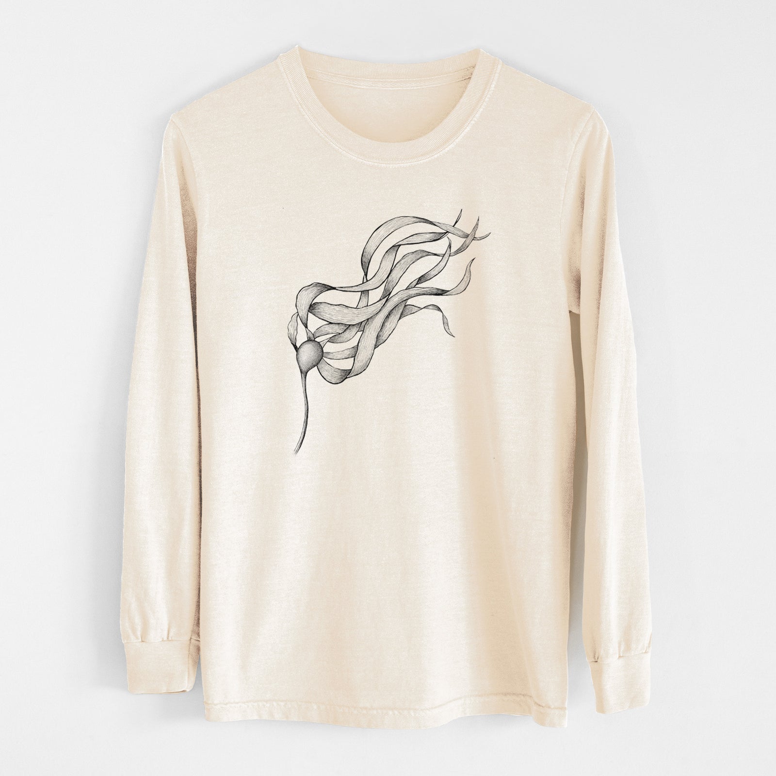 Ivory Comfort Colors long sleeve shirt laid flat, printed with a black ink line drawing of a strand of bull kelp with long flowing blades.