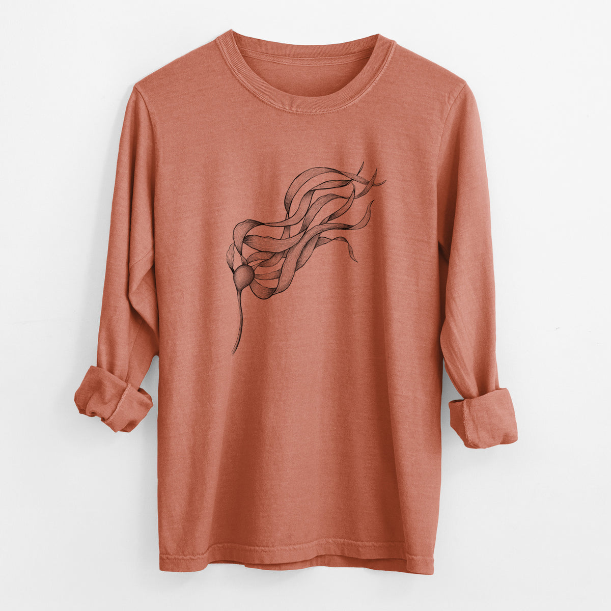 Yam burnt orange Comfort Colors long sleeve shirt laid flat with the cuffs rolled, printed with a black ink line drawing of a strand of bull kelp with long flowing blades.
