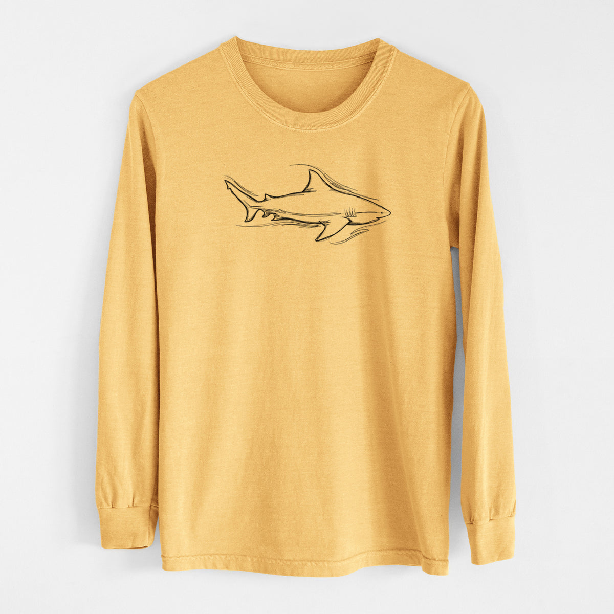 Golden wheat yellow Comfort Colors long sleeve shirt laid flat, printed with a black ink illustration of a bull shark swimming.