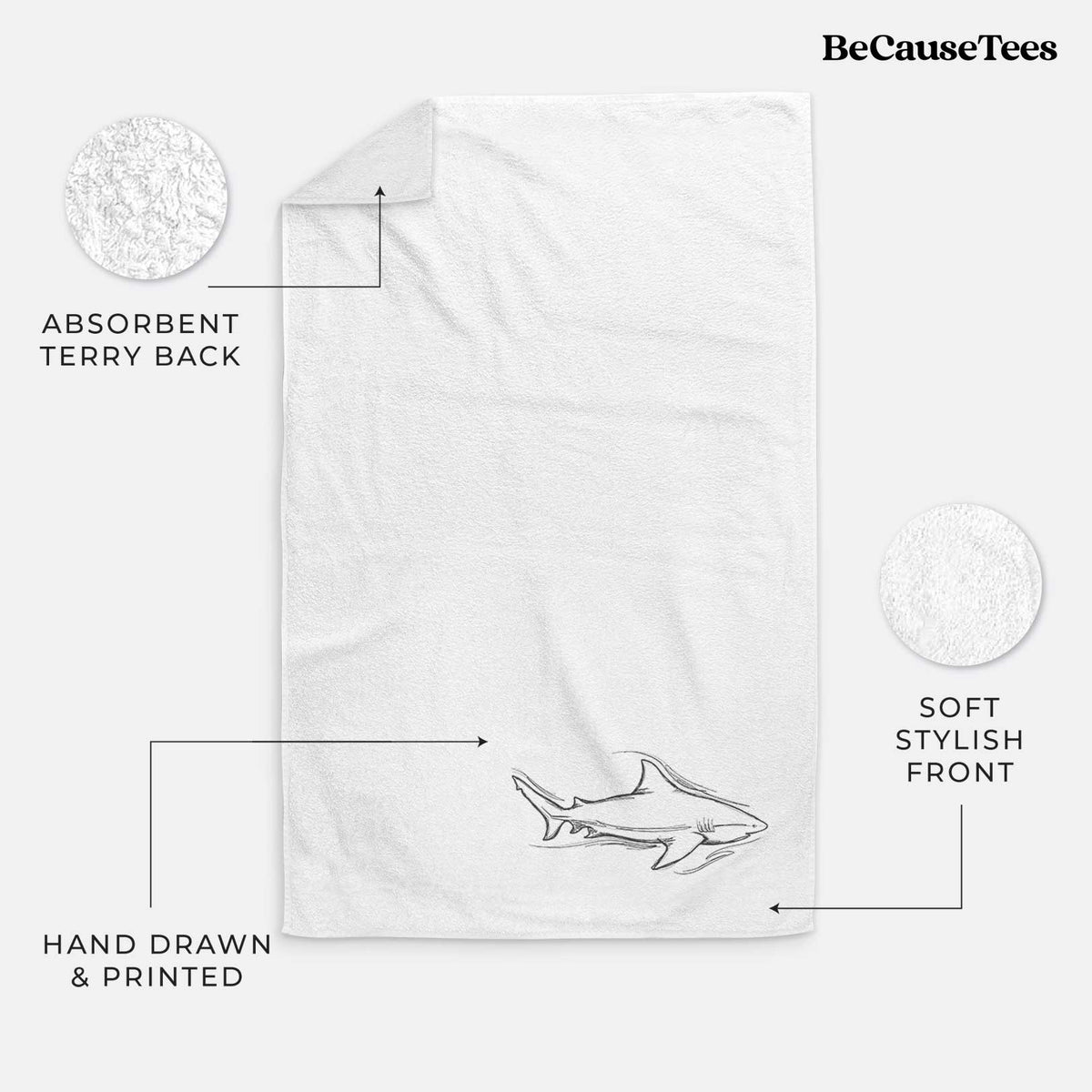 White hand towel printed with a black ink illustration of a bull shark swimming.