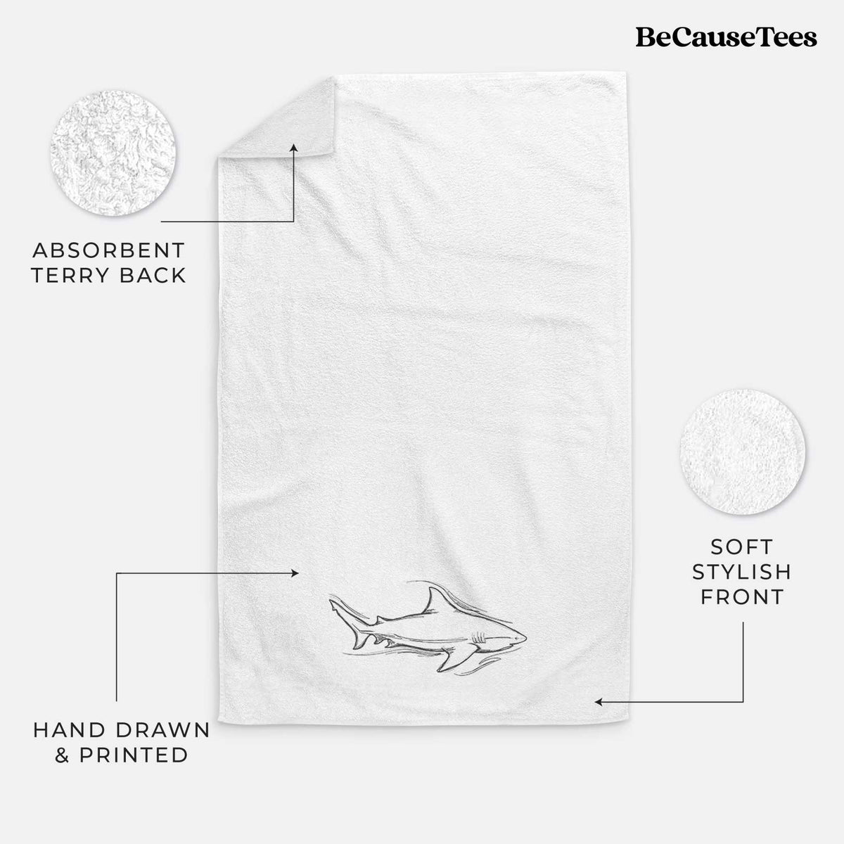 White hand towel printed with a black ink illustration of a bull shark swimming.