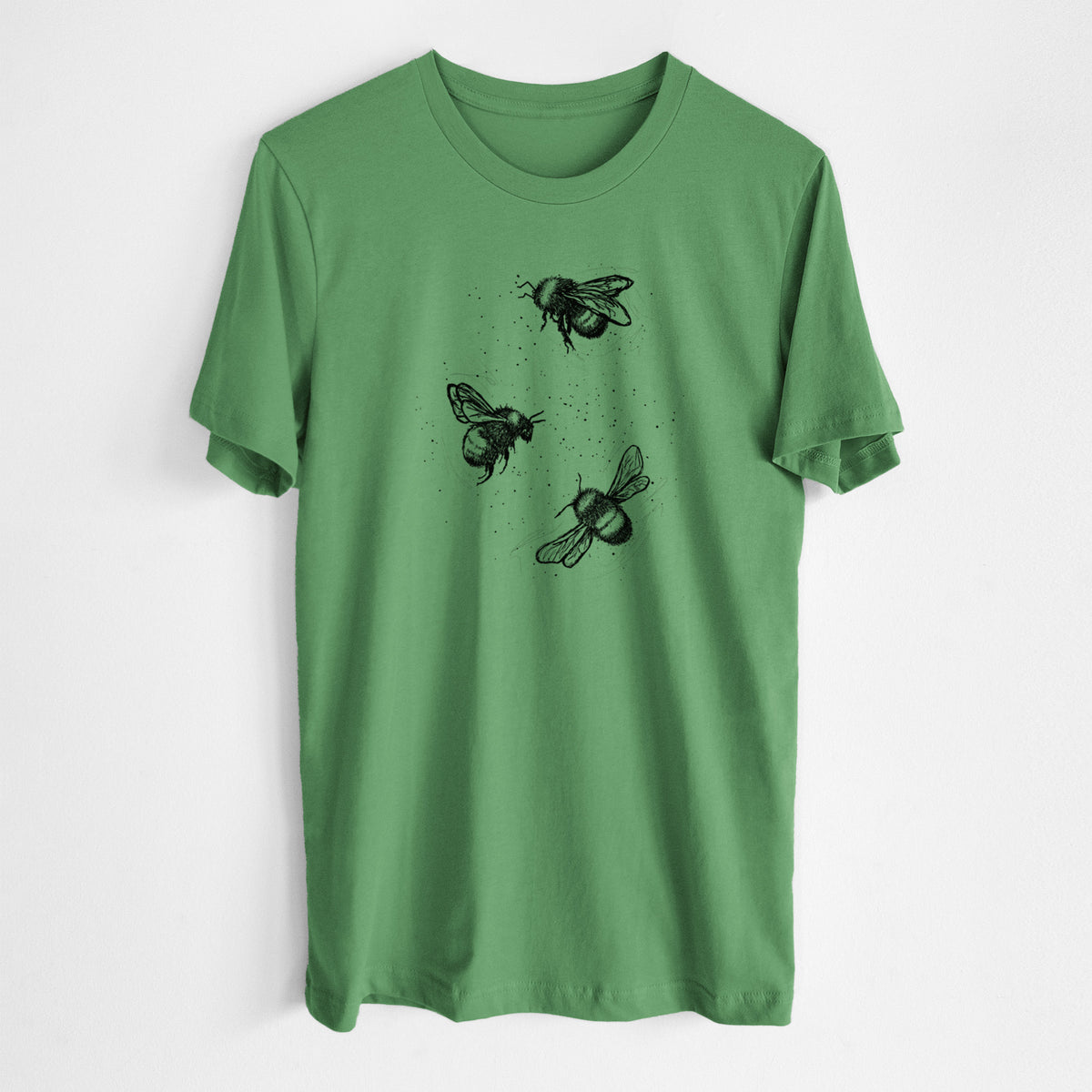 Leaf green lightweight cotton t-shirt laid flat, printed with a black ink illustration of three bumble bees flying.