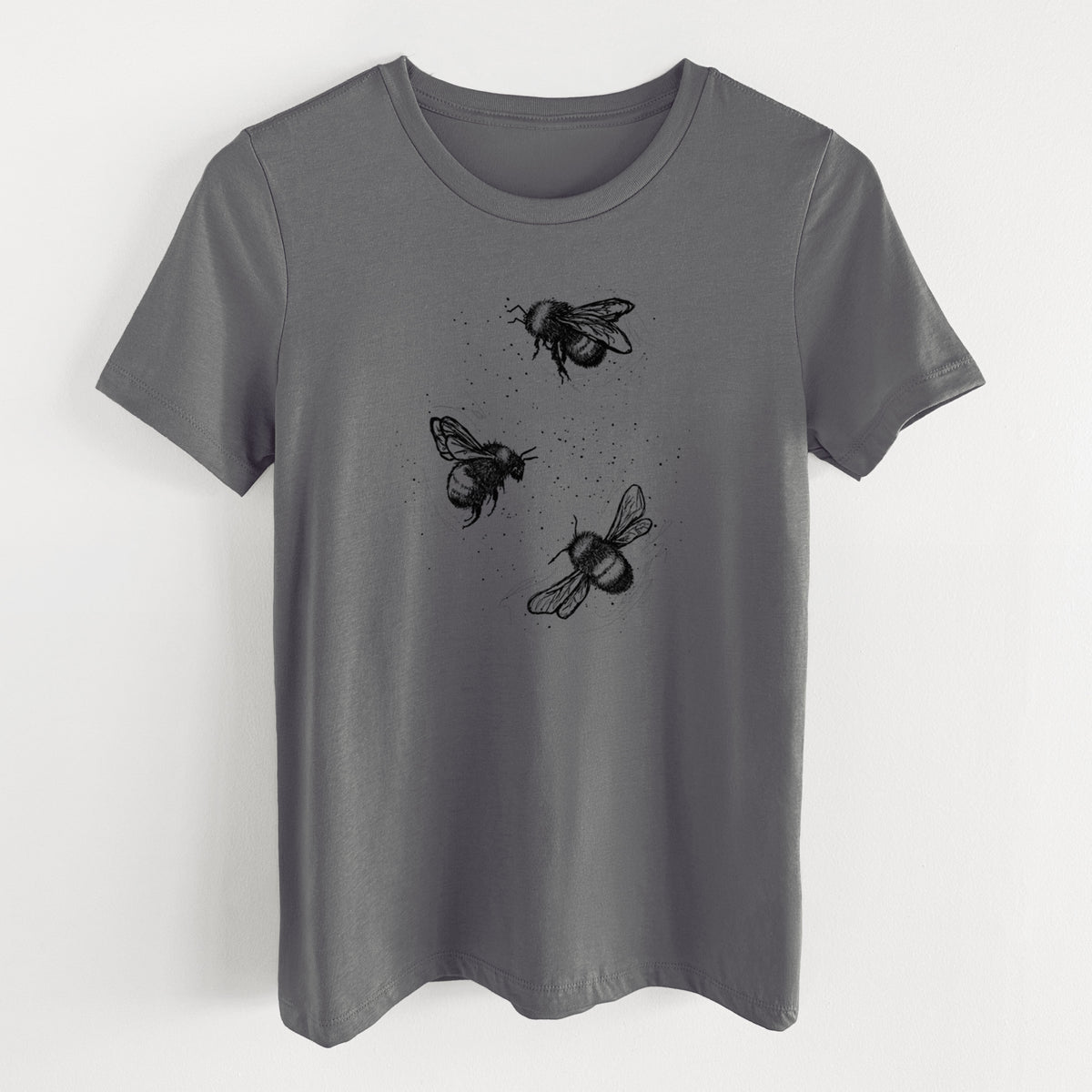 Asphalt women's relaxed fit cotton t-shirt laid flat, printed with a black ink illustration of three bumble bees flying.