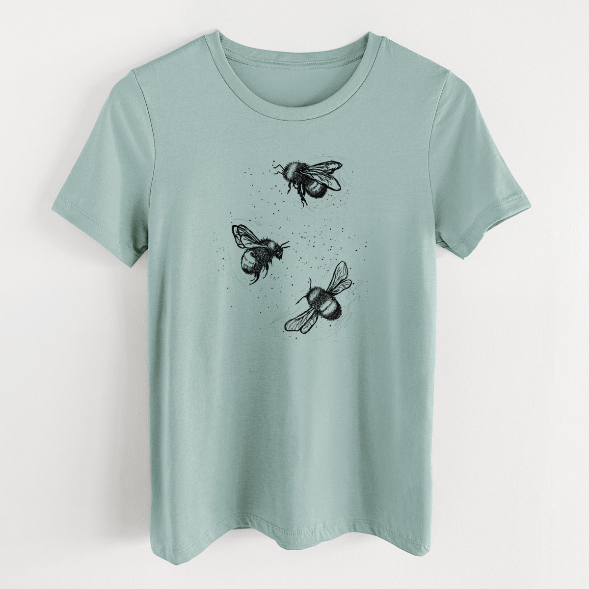 Dusty blue women's relaxed fit cotton t-shirt laid flat, printed with a black ink illustration of three bumble bees flying.
