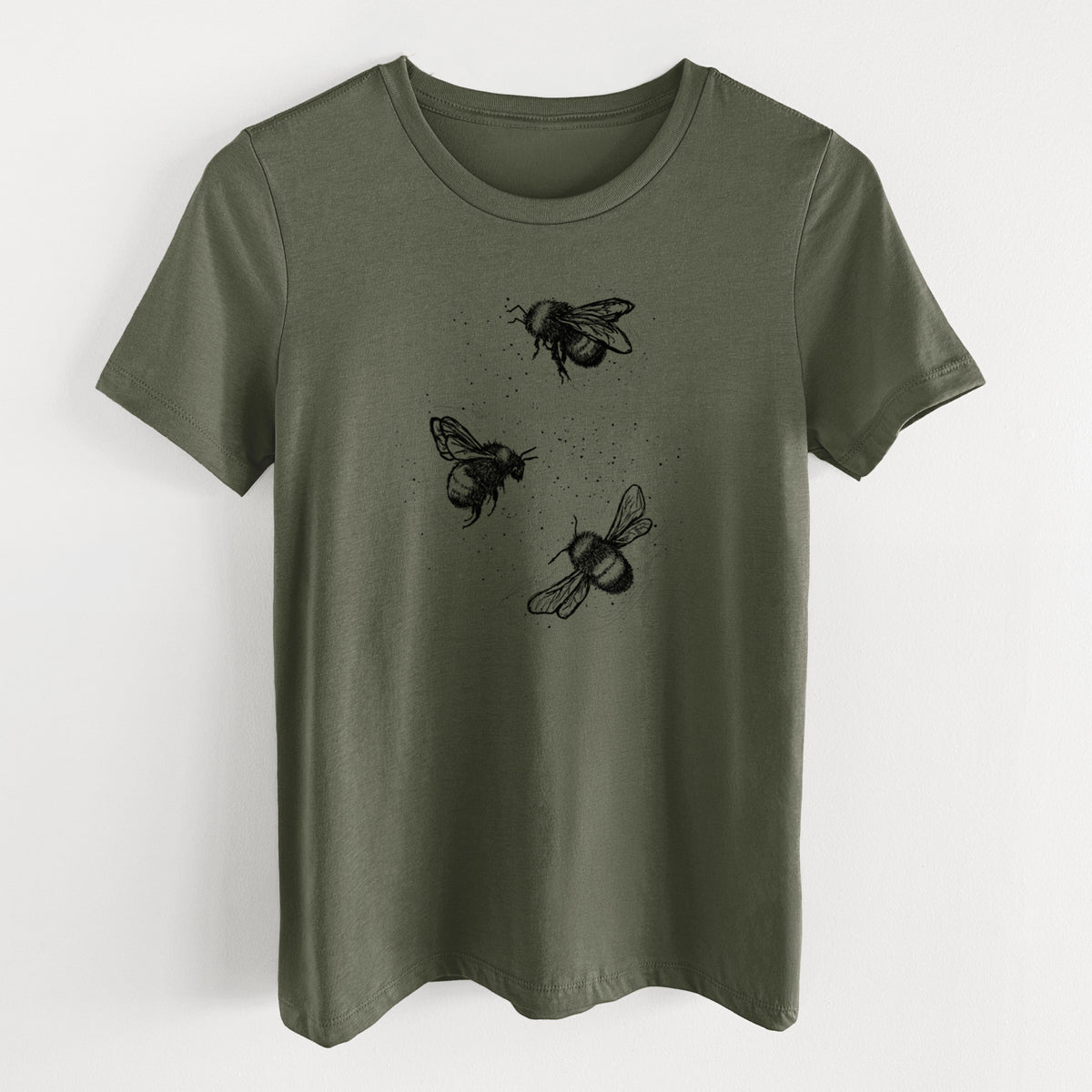 Military green women's relaxed fit cotton t-shirt laid flat, printed with a black ink illustration of three bumble bees flying.