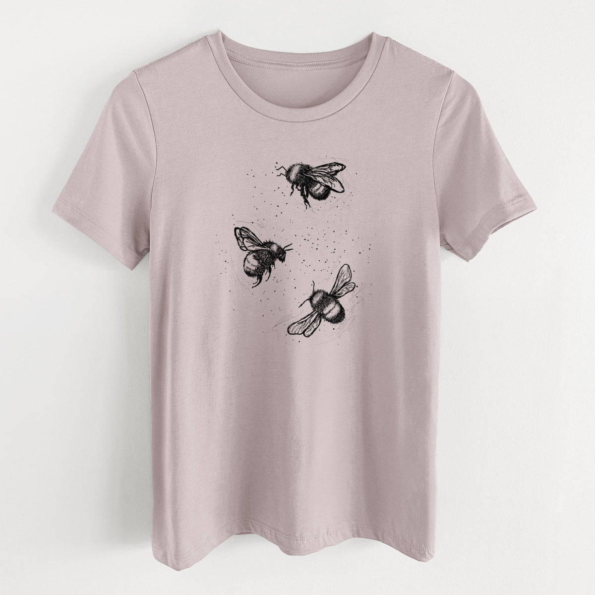 Pink gravel women's relaxed fit cotton t-shirt laid flat, printed with a black ink illustration of three bumble bees flying.