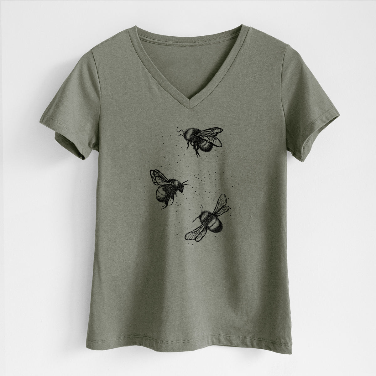 Military green women's relaxed fit cotton V-neck t-shirt laid flat, printed with a black ink illustration of three bumble bees flying.