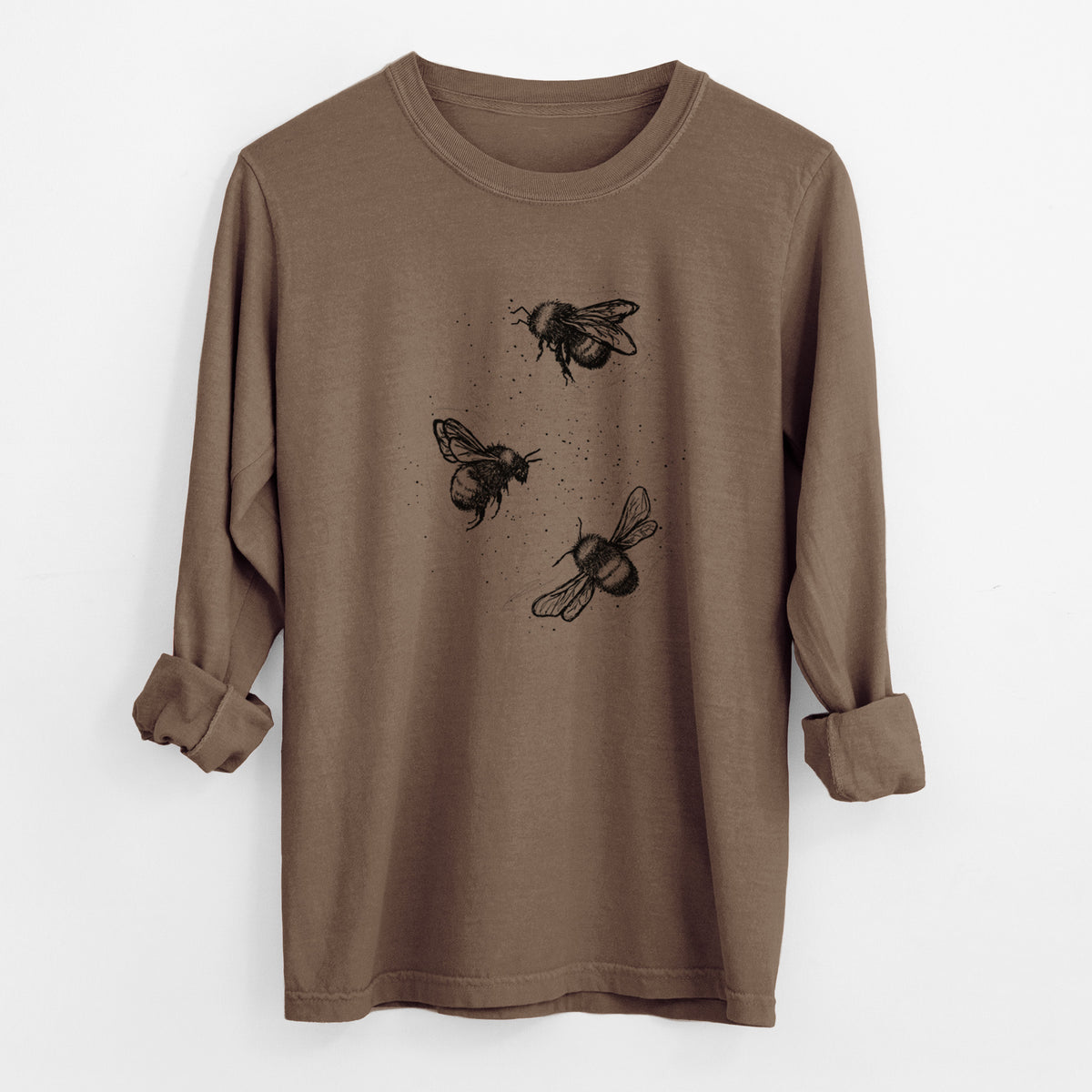 Espresso brown Comfort Colors long sleeve shirt laid flat with the cuffs rolled, printed with a black ink illustration of three bumble bees flying.