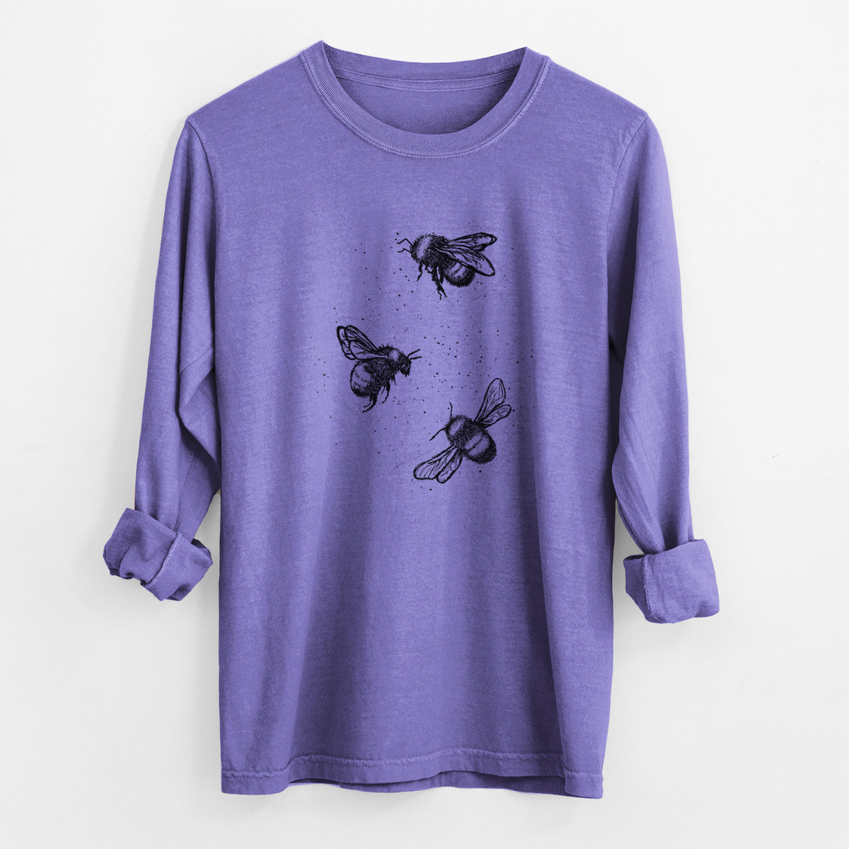 Violet purple Comfort Colors long sleeve shirt laid flat with the cuffs rolled, printed with a black ink illustration of three bumble bees flying.
